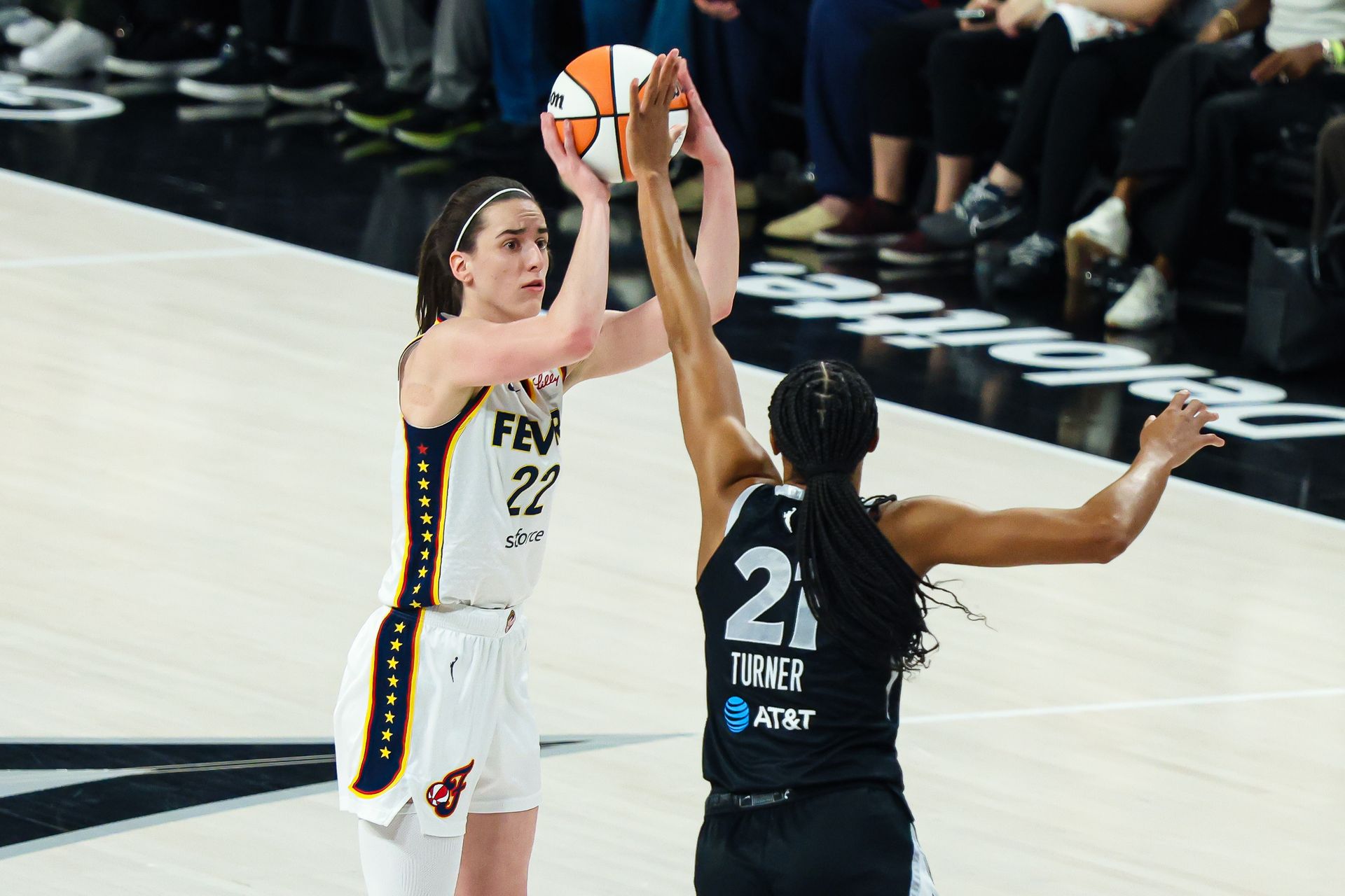Caitlin Clark attempts a three-pointer against the Aces