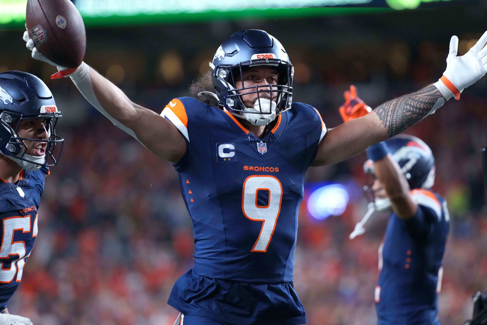 Talanoa Hufanga celebrates with fans after a game-winning intercept