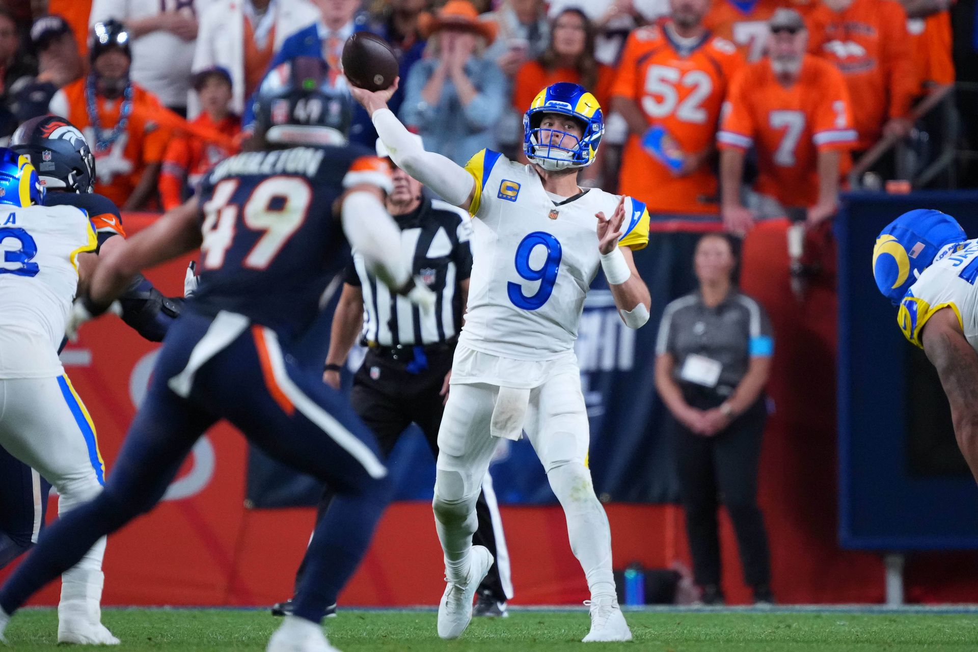 Stafford in action, throwing the football against the Broncos