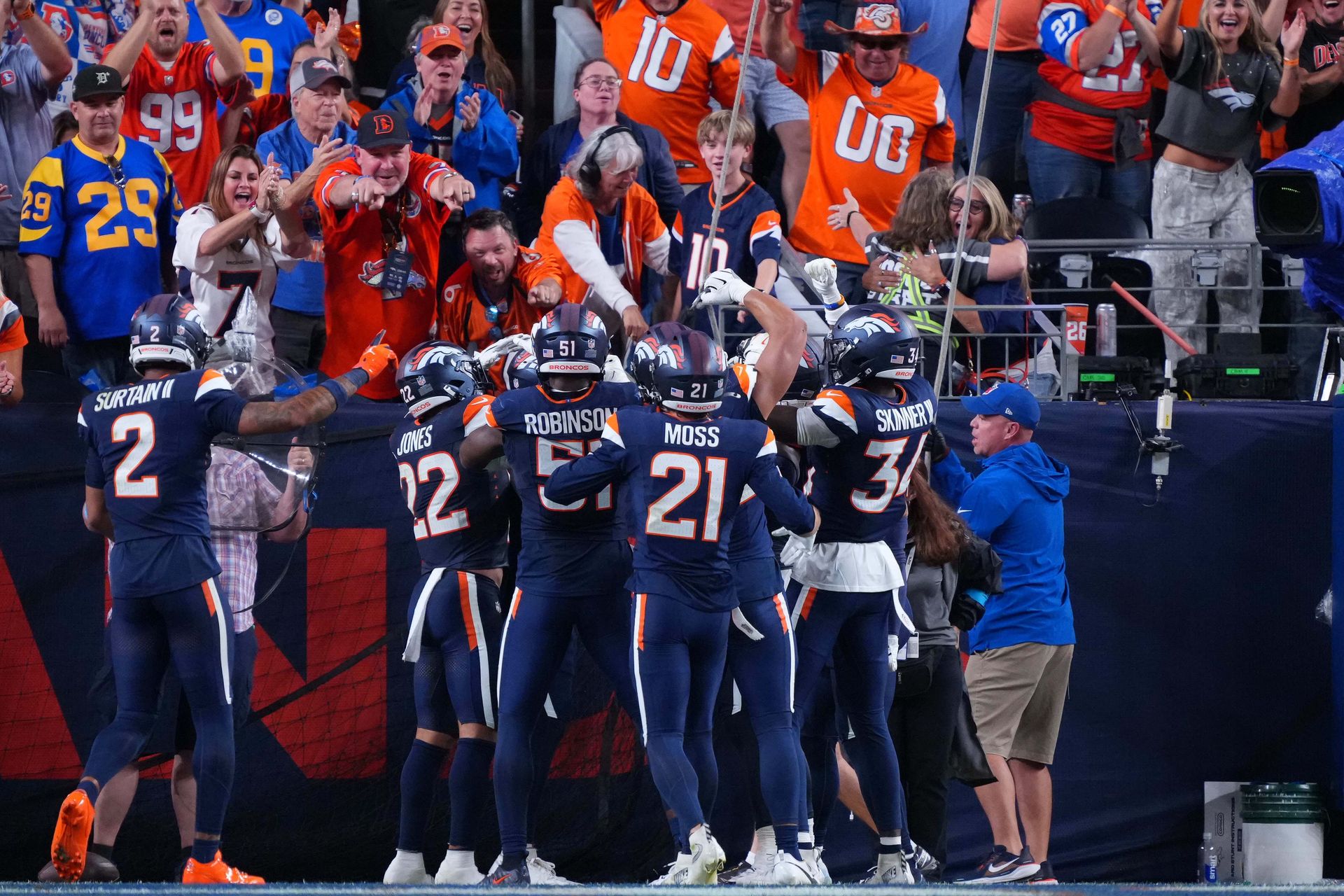 Hufanga celebrates a pick six with Broncos fans