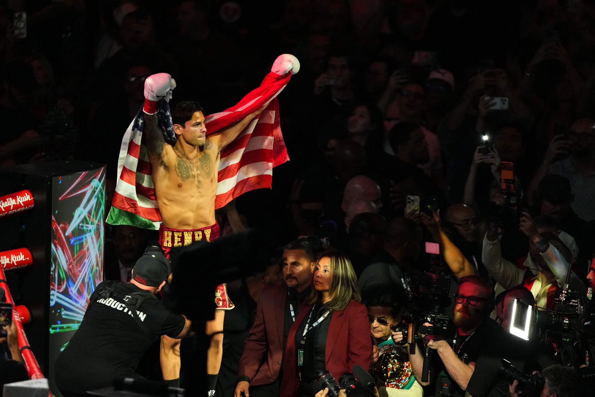 Ryan Garcia celebrates with flags after his victory over Conor Benn