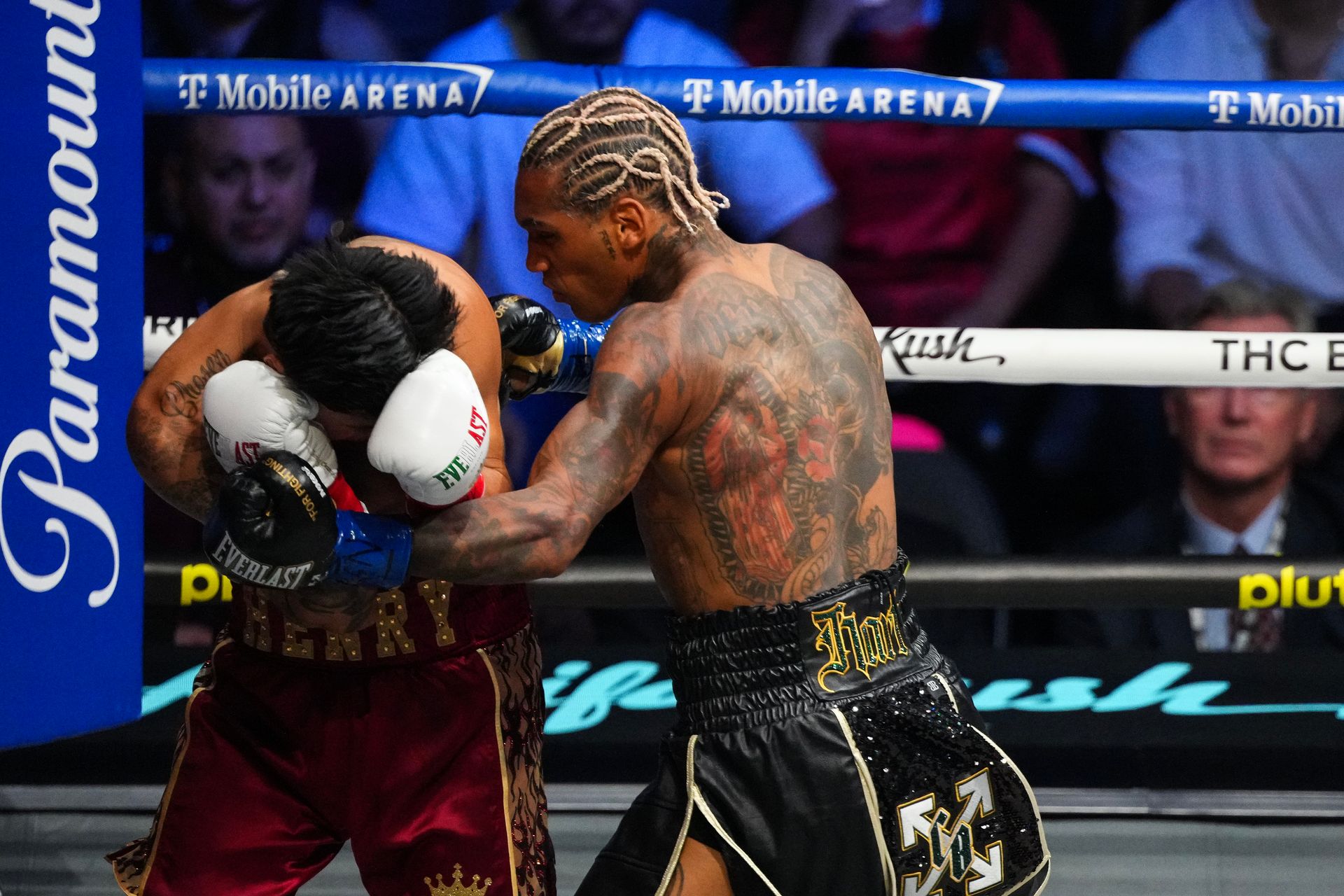 Conor Benn strikes Ryan Garcia during their title fight
