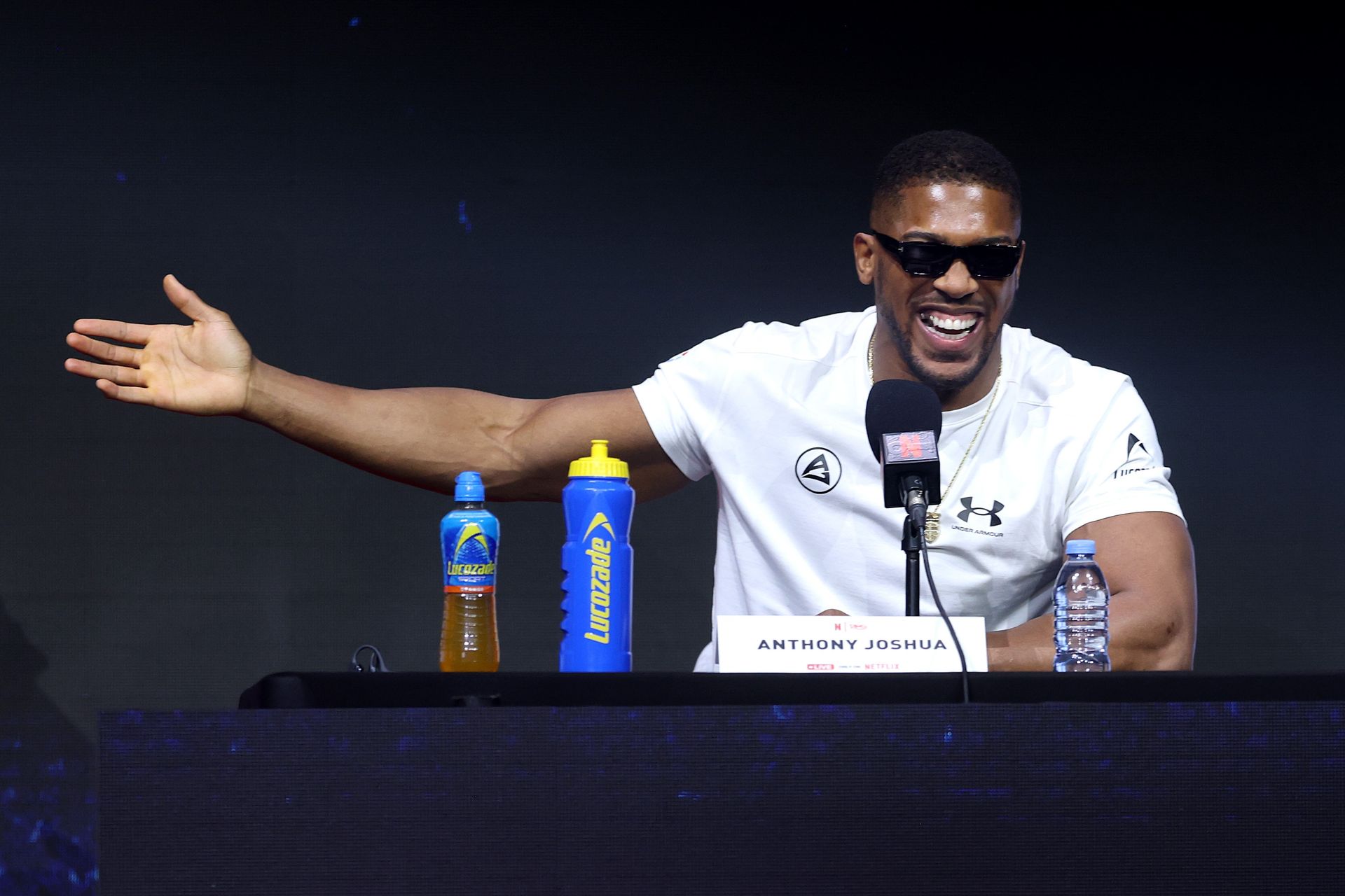 Anthony Joshua points at Tyson Fury in a heated moment at the press conference.