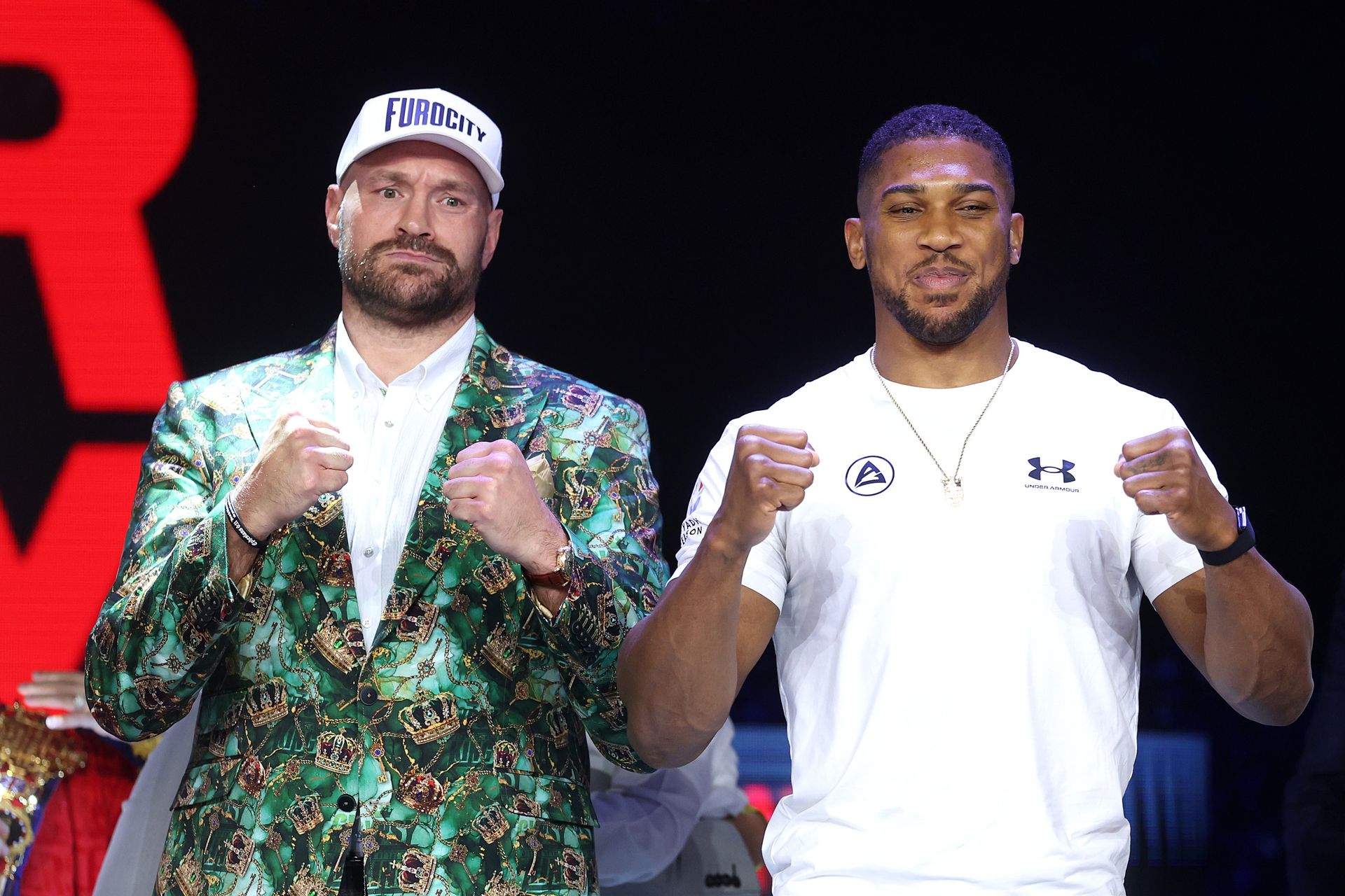 Fury and Joshua pose with fists raised at the London press conference.