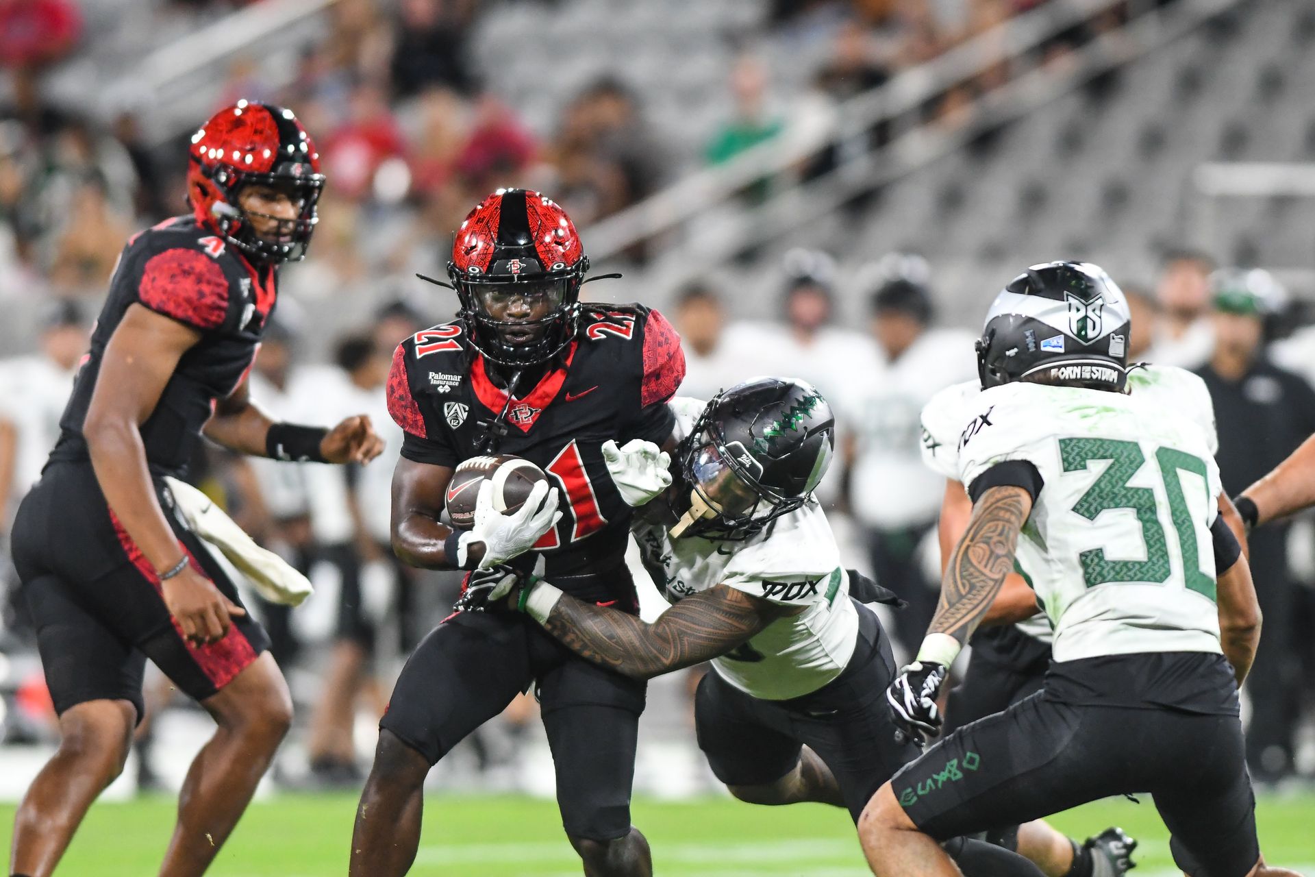 Javion Kinnard carries the ball in SDSU's offensive drive