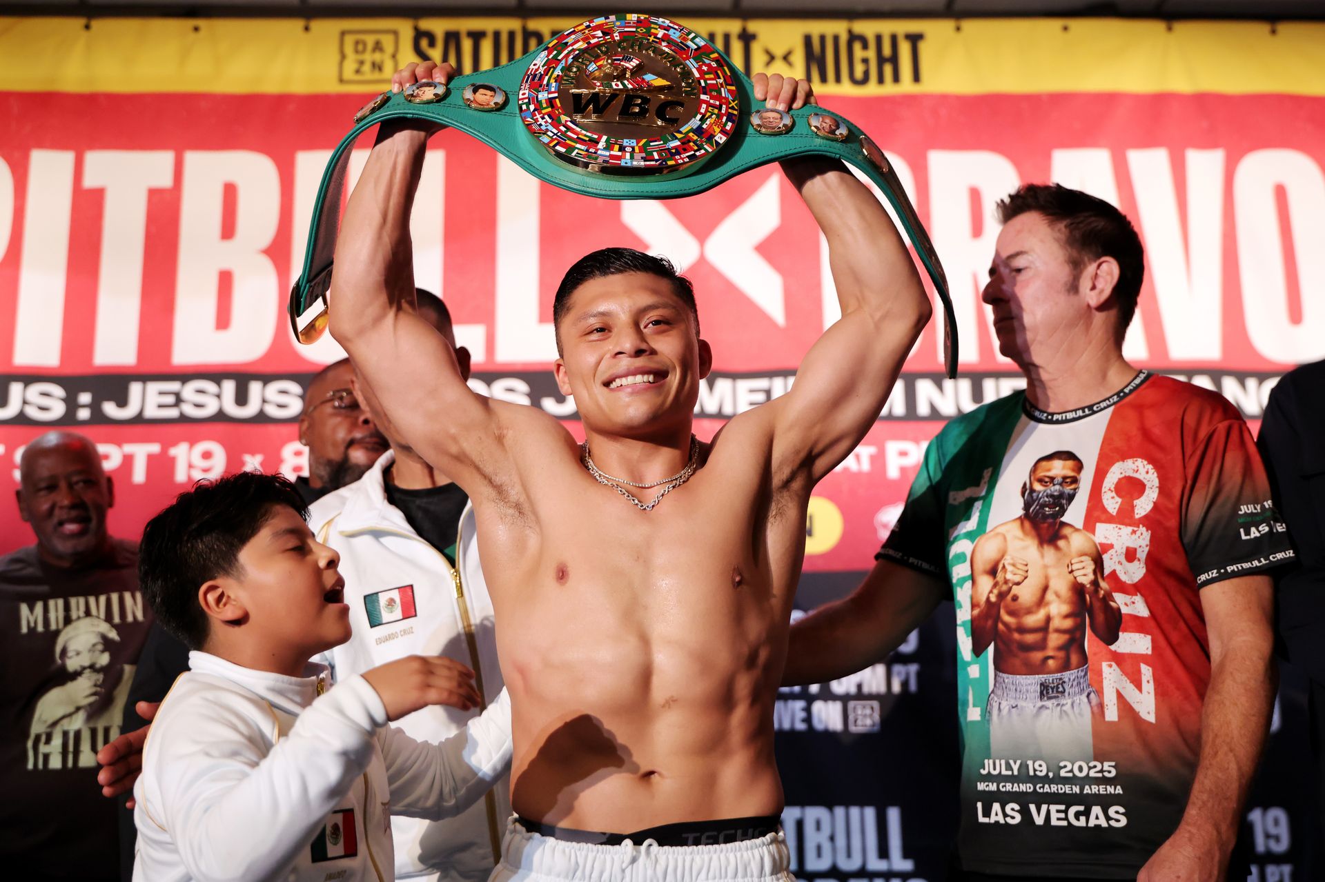 Isaac Cruz showcases title post weigh-in with his son