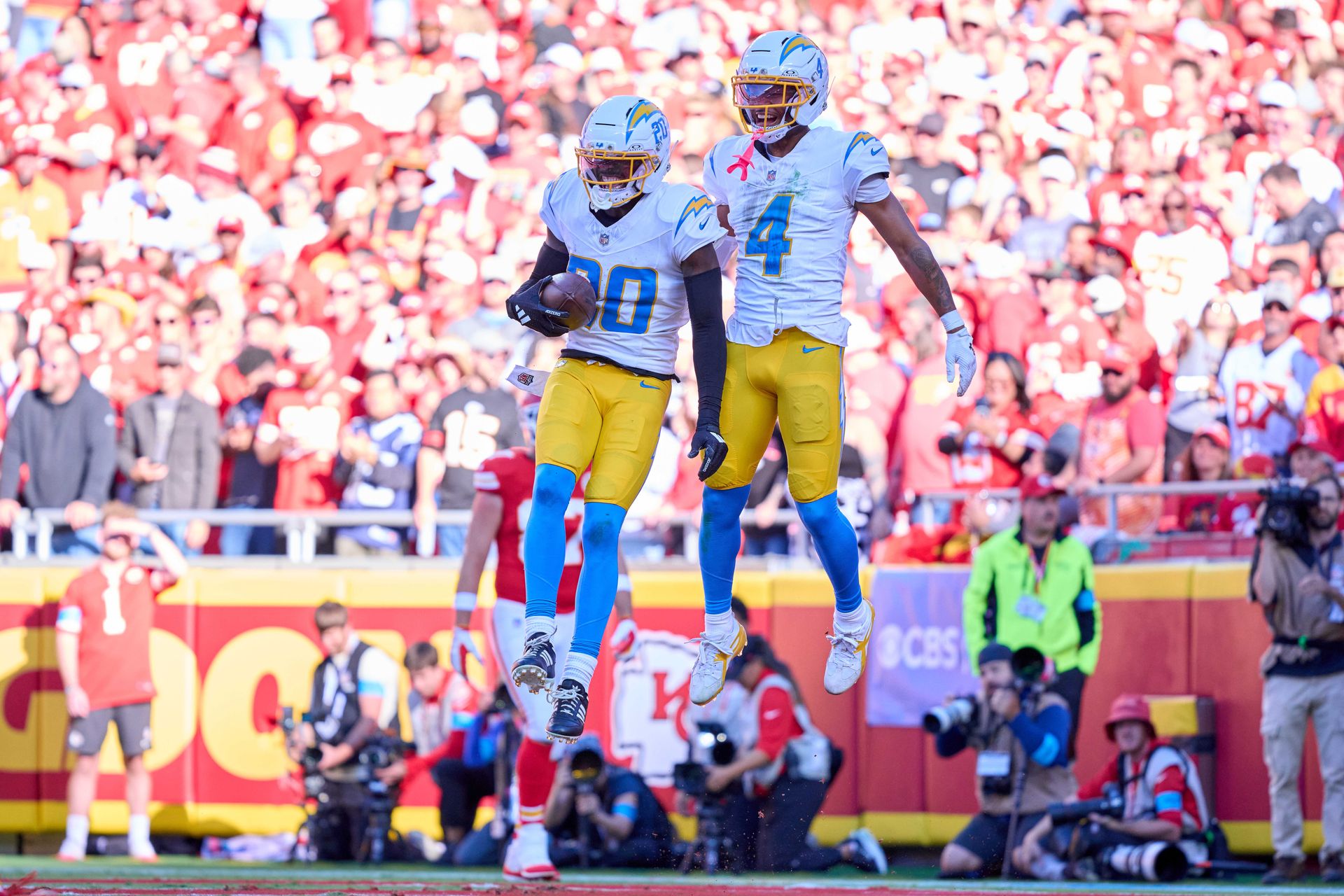Cam Hart celebrates with Tarheeb Still after a play against the Chiefs