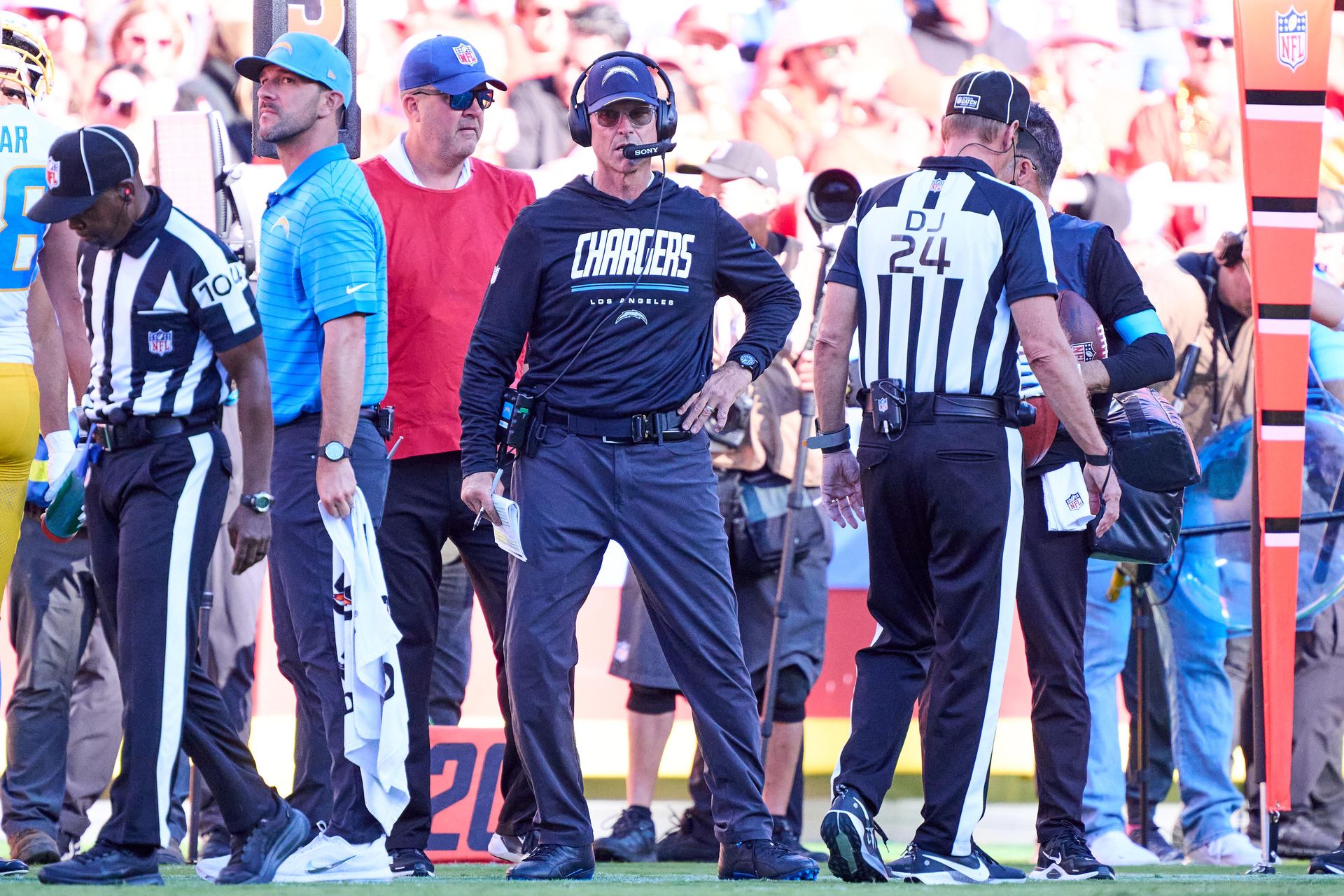 Chargers coach Jim Harbaugh watches the action at Arrowhead Stadium