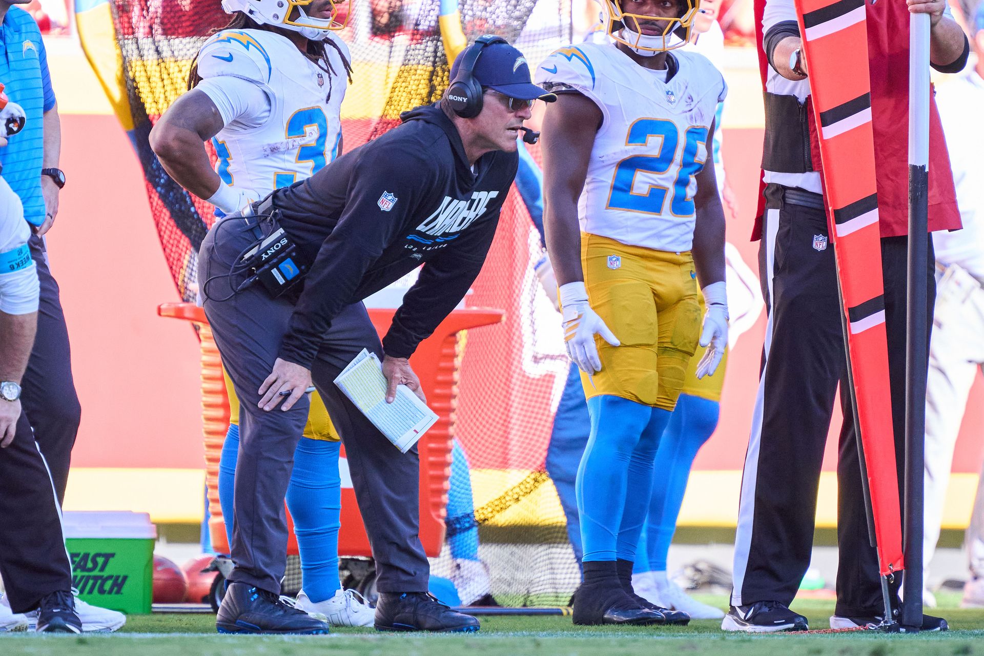 Jim Harbaugh looks on during the Chargers-Chiefs matchup