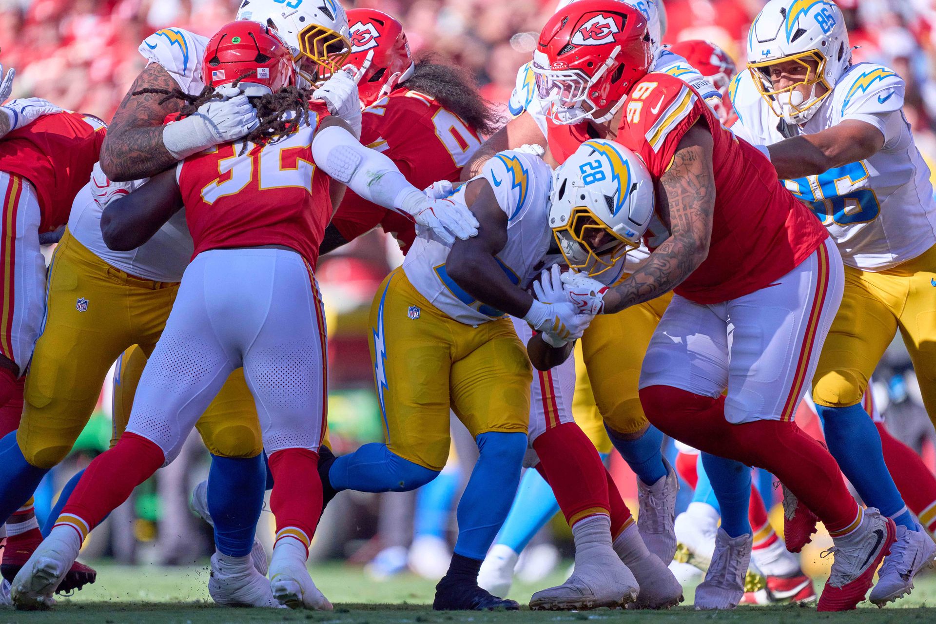 Kimani Vidal carries the ball against the Kansas City Chiefs