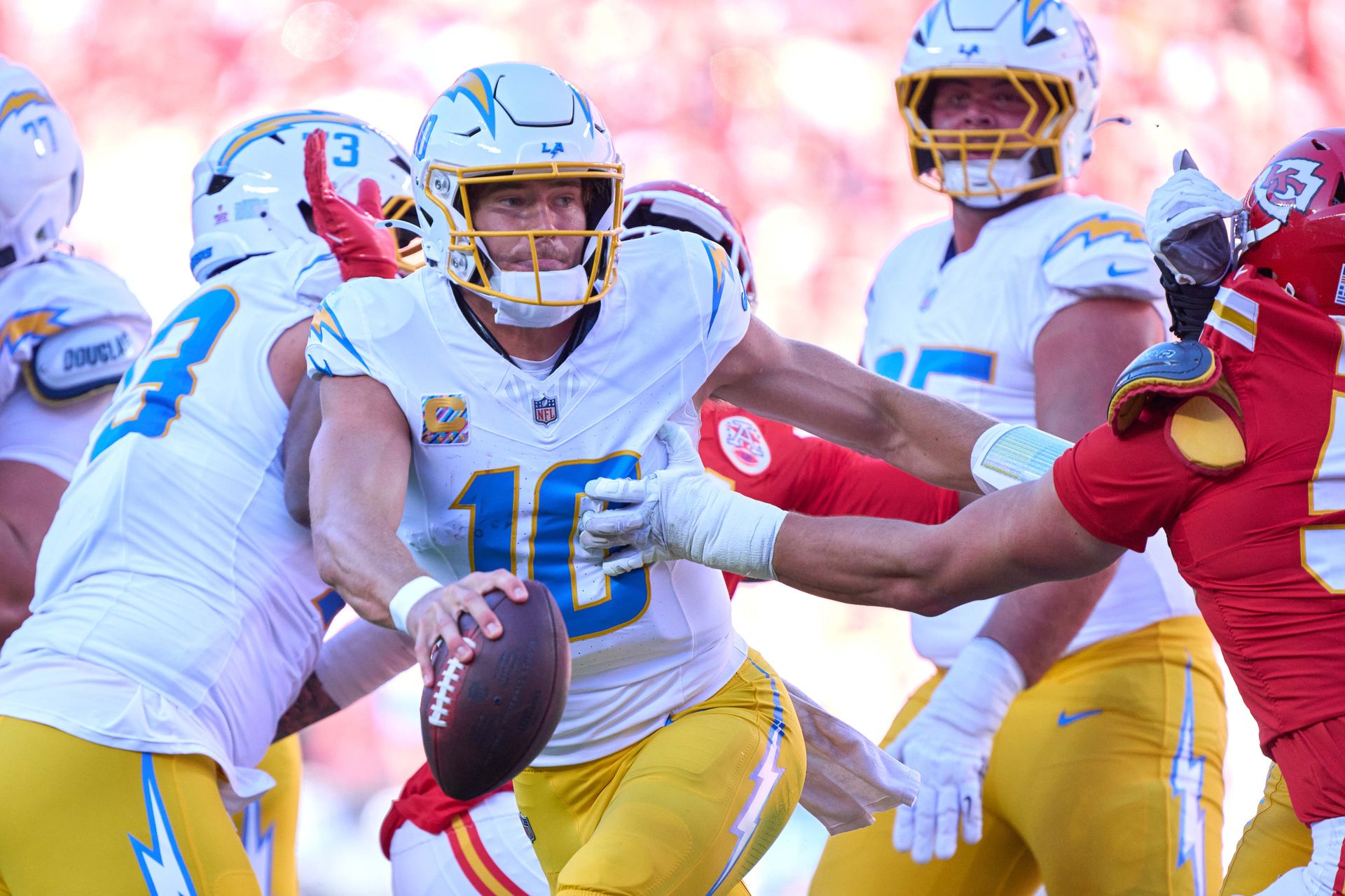 Justin Herbert handles the ball during the Chargers-Chiefs game