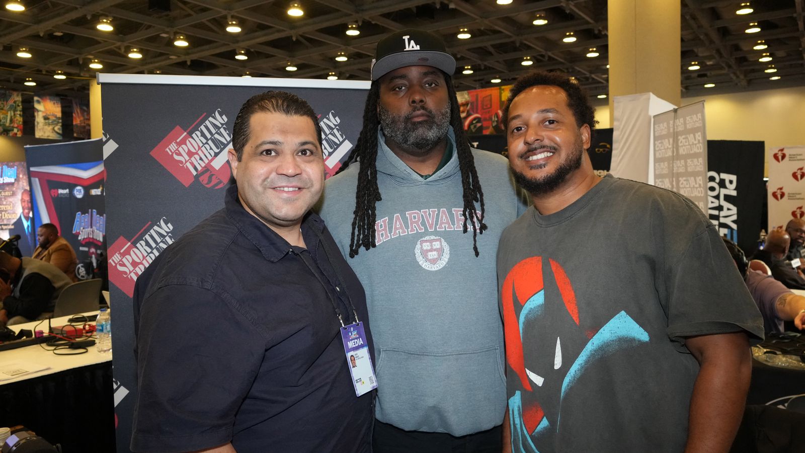 Arash Markazi with Mykell Mathieu and Eric Lambkins II at Super Bowl LX.