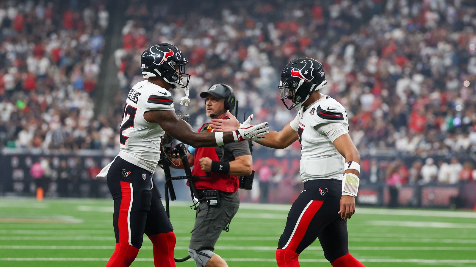 C.J. Stroud celebrates a touchdown with Nico Collins against the Cowboys.