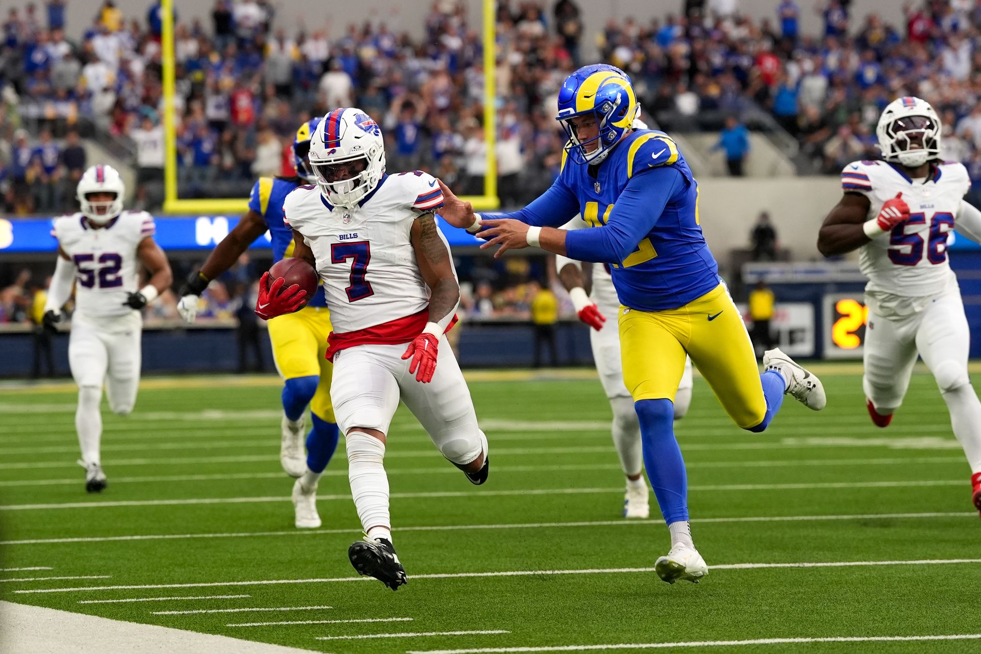 Ray Davis Carries the Ball Against the Rams
