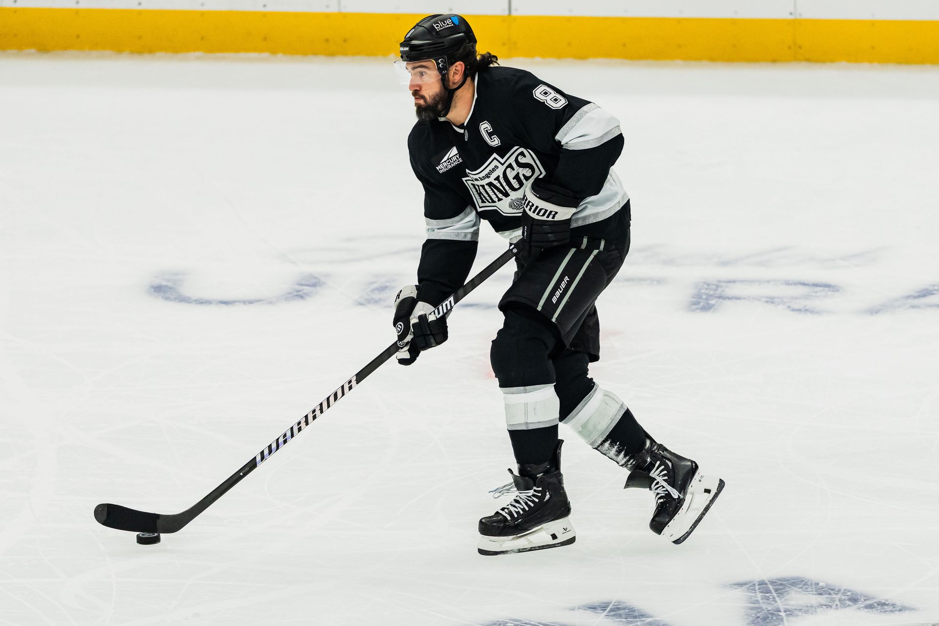 Drew Doughty Carries the Puck Up the Ice