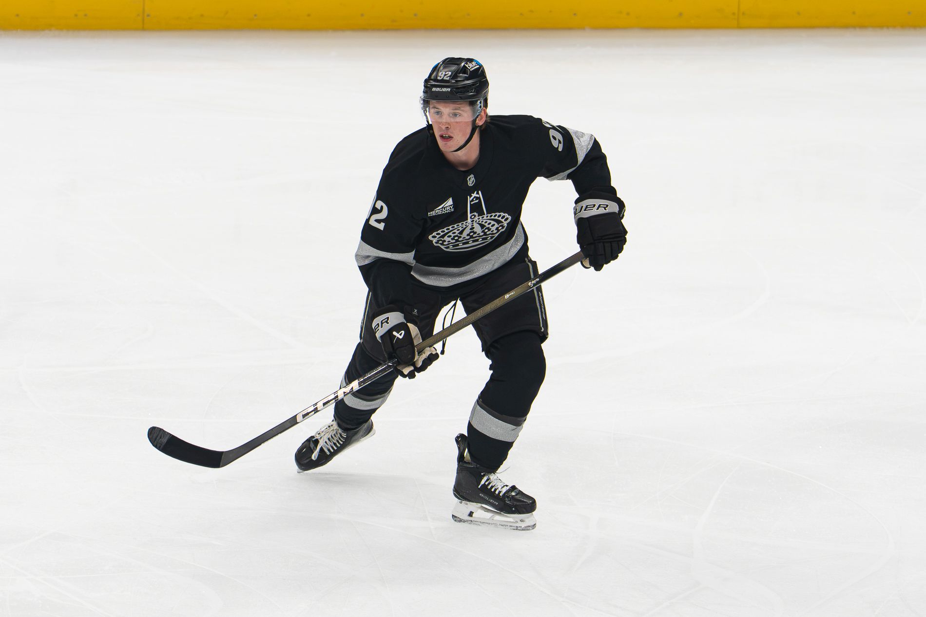 Brandt Clarke skates against the Boston Bruins