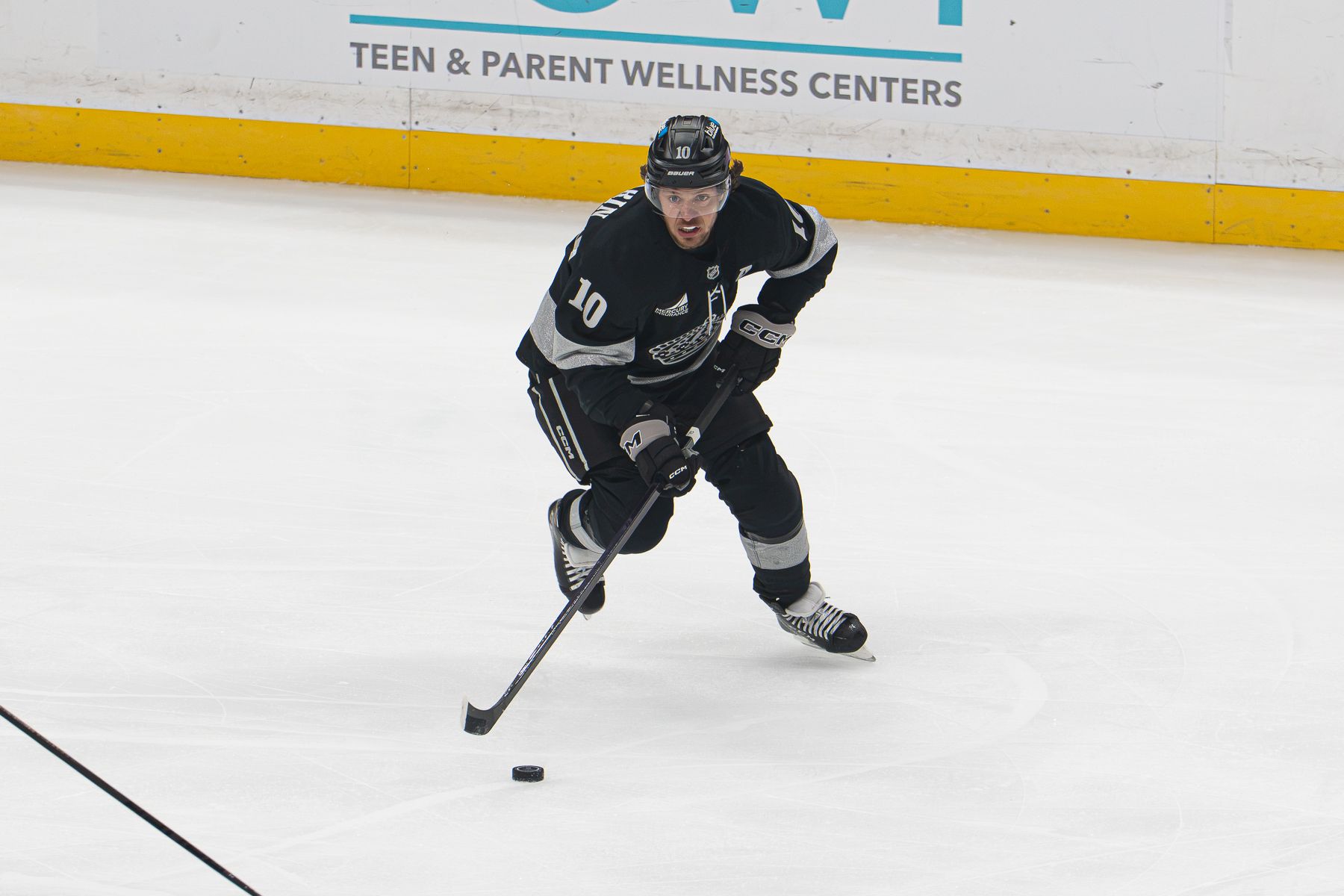 Artemi Panarin advances the puck against Boston