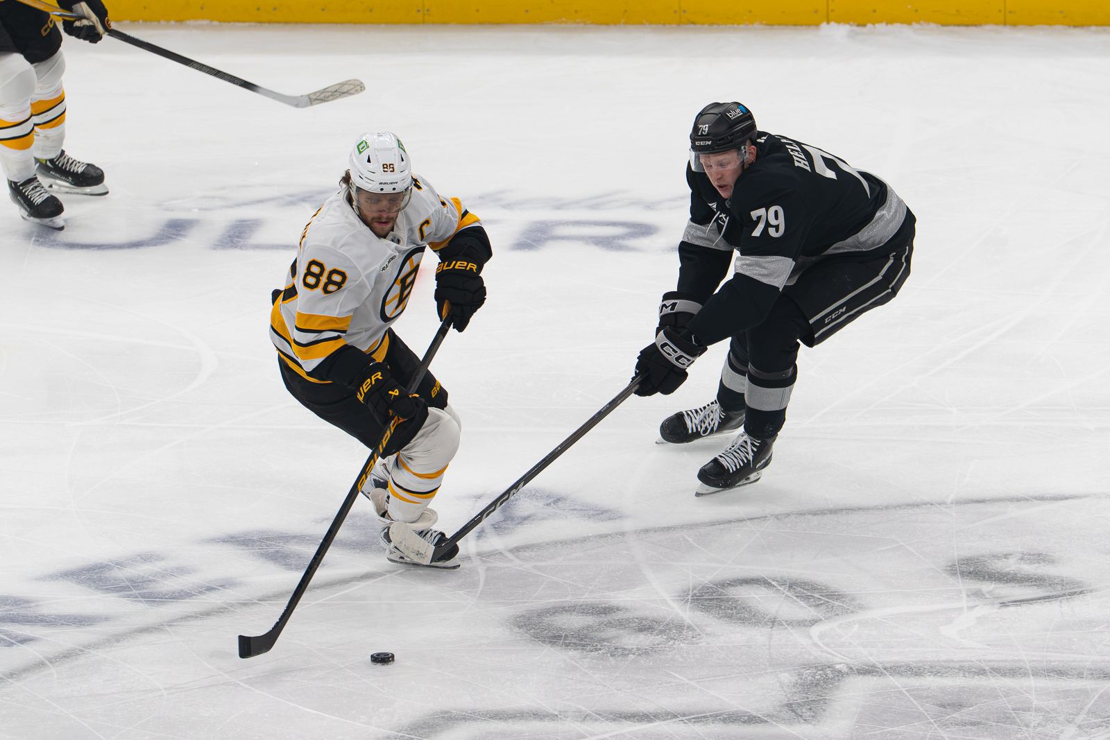Samuel Helenius chases the puck against the Bruins