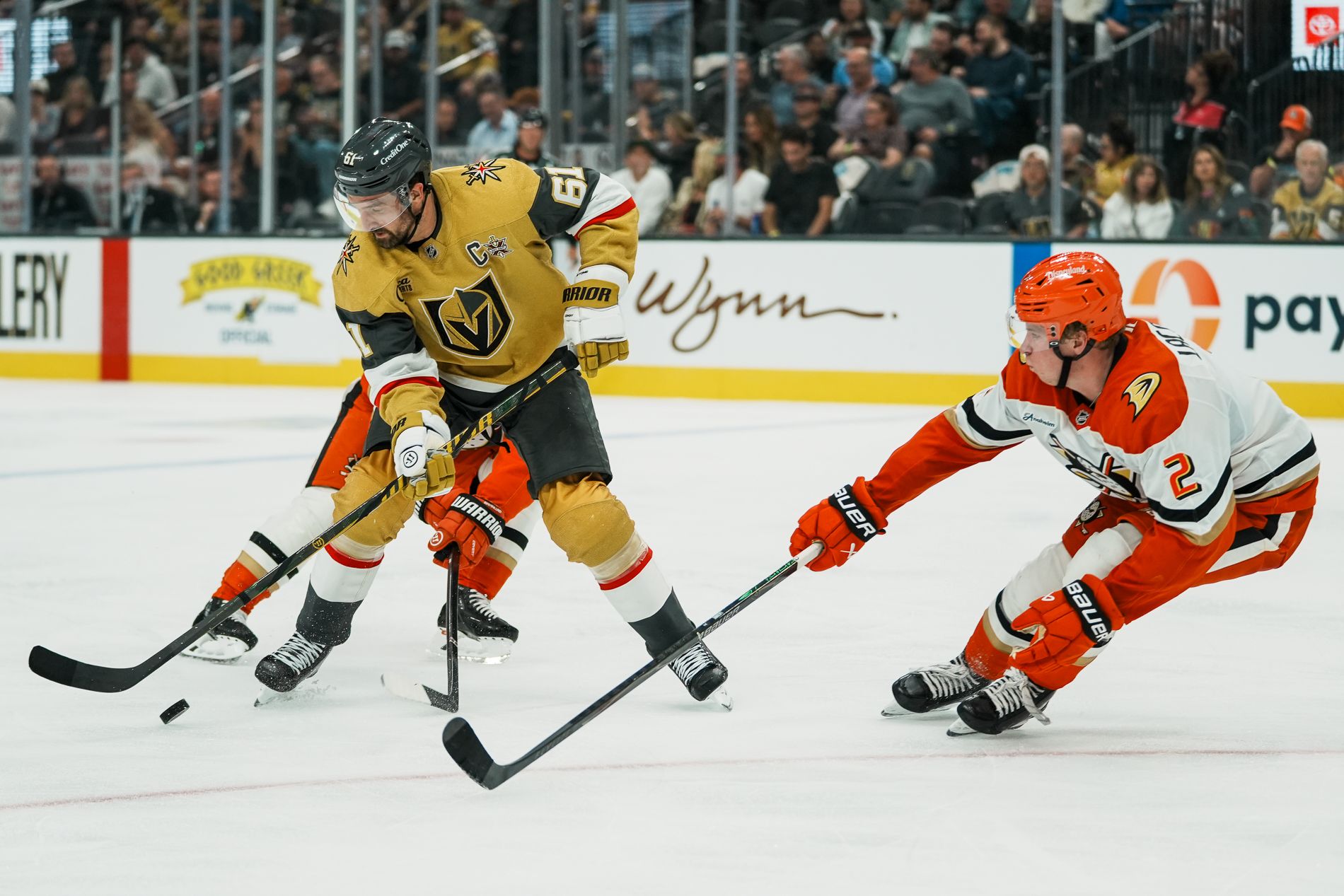 Mark Stone and Jackson LaCombe reach for the puck in a game-deciding moment.