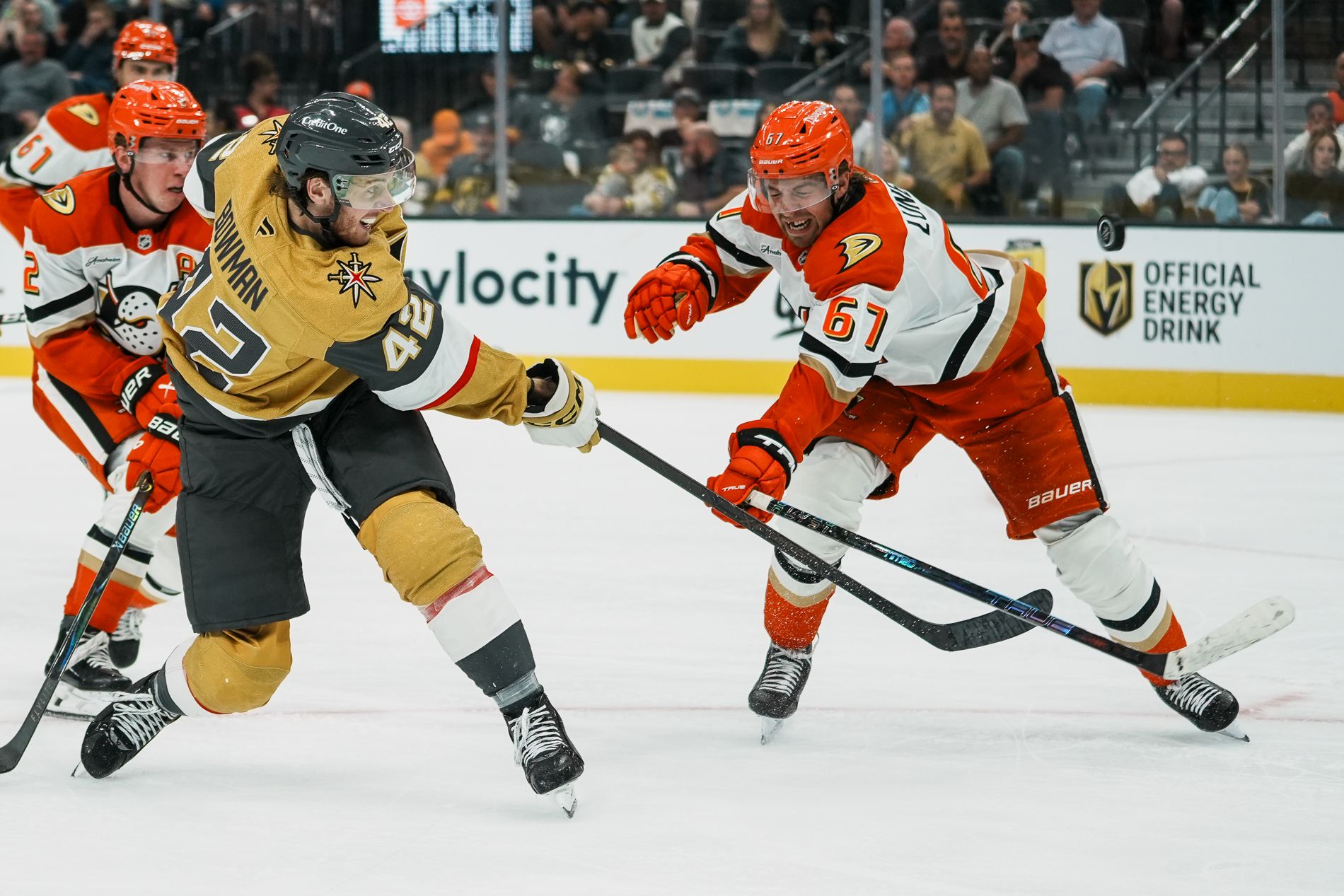Braeden Bowman makes a shot past Tristan Luneau in a heated NHL moment.