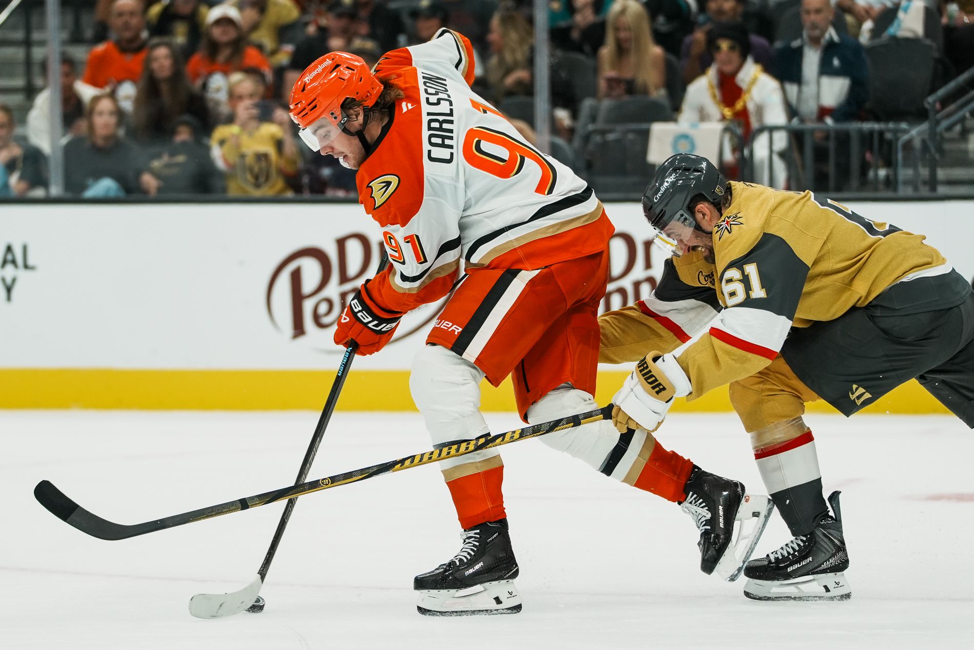 Mark Stone reaches for the puck against Leo Carlsson during a crucial play.