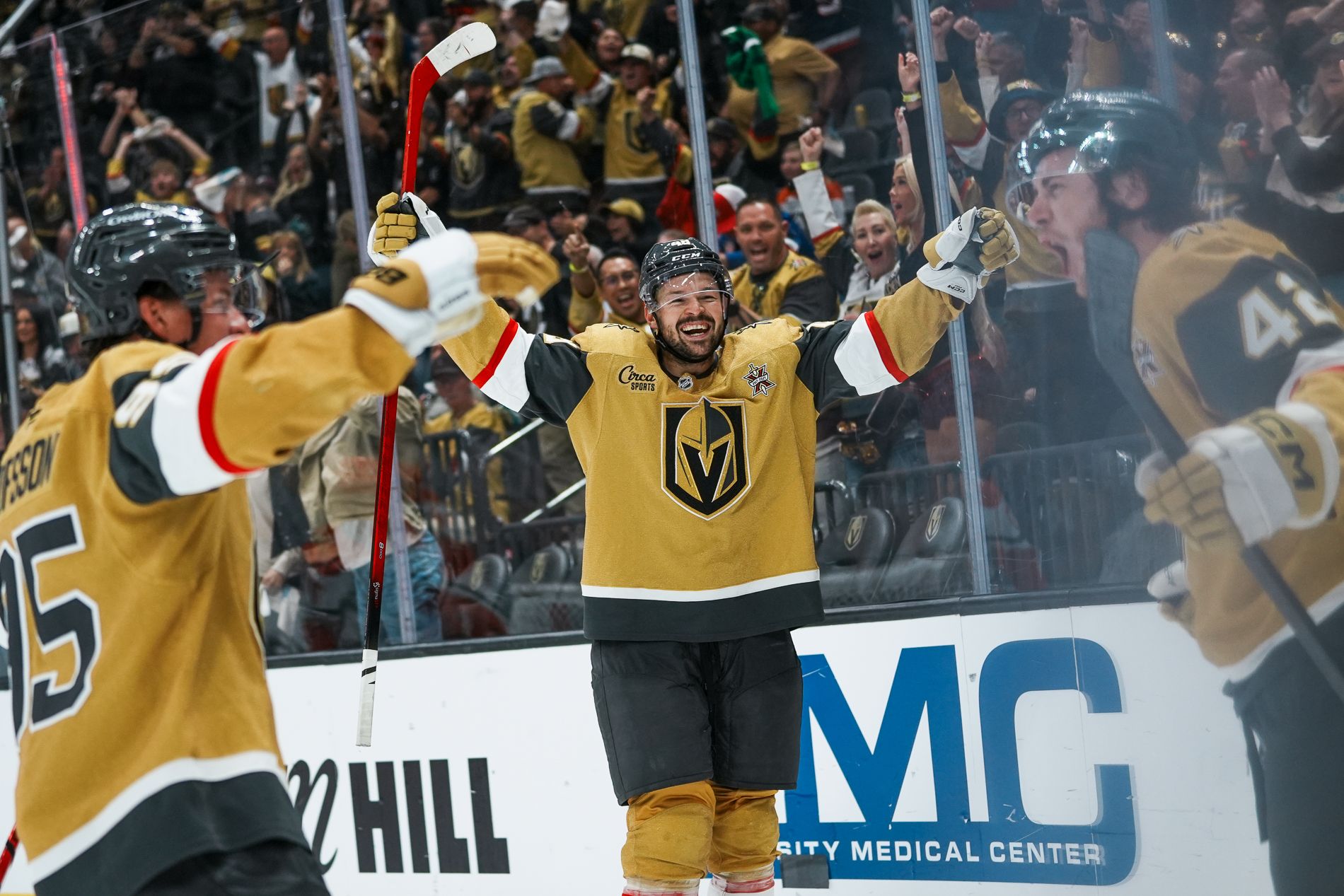 Golden Knights' Olofsson, Hertl, and Bowman celebrate a third-period goal.