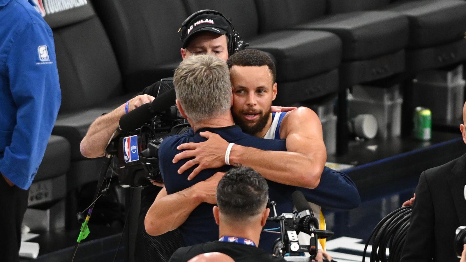 Steph Curry and coach Steve Kerr celebrate after a game in 2026.