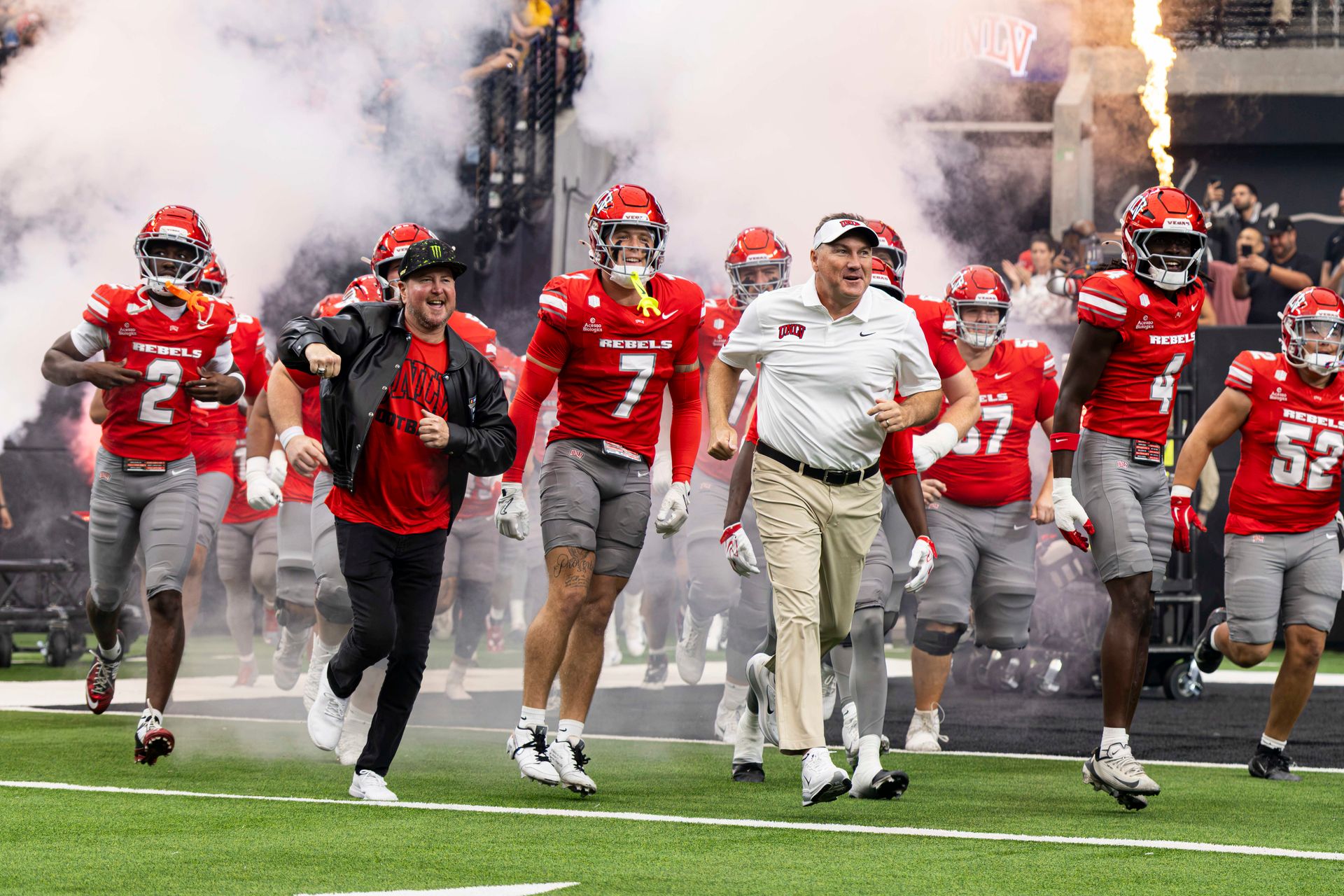 Coach Dan Mullen and Kurt Busch share a pre-game run