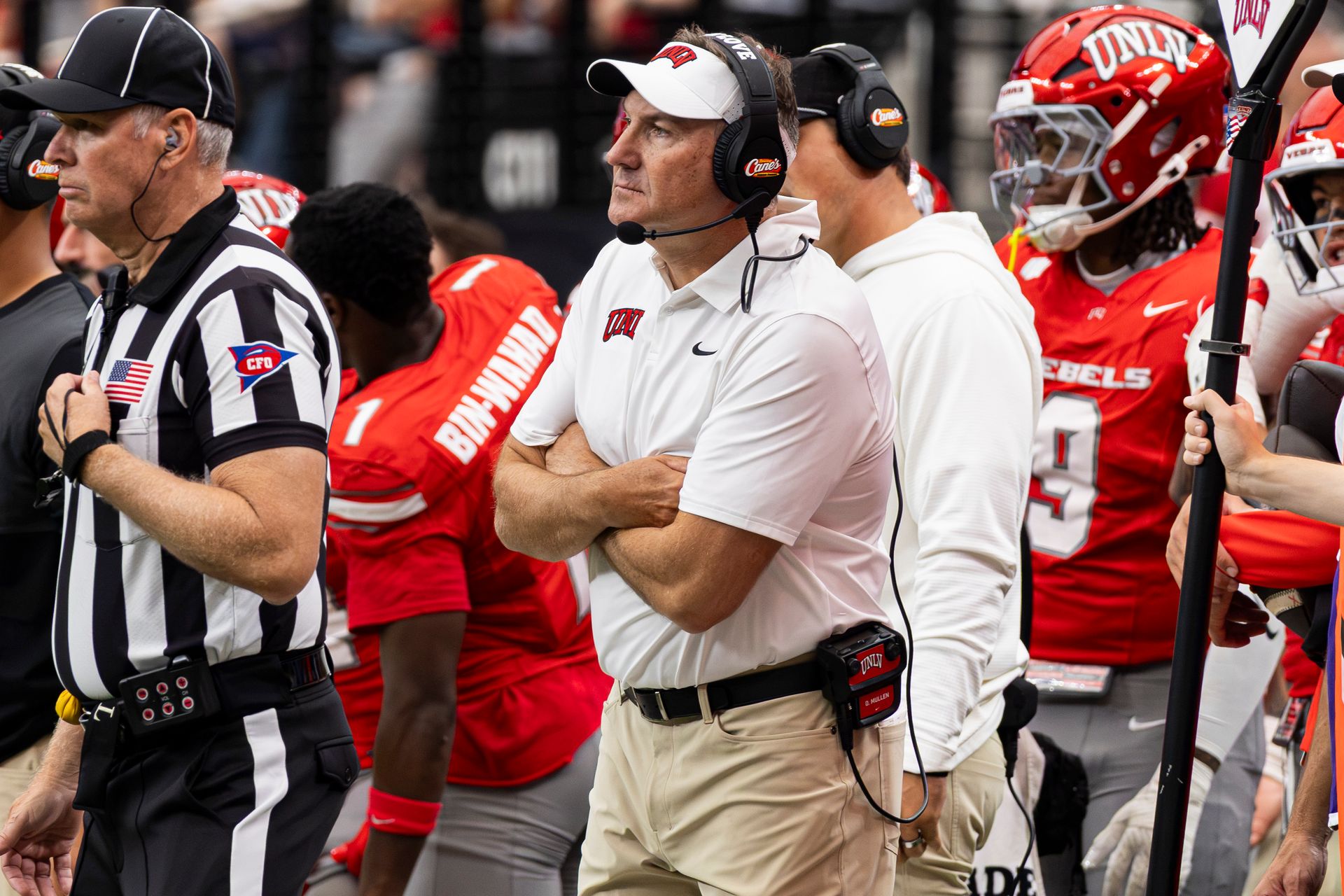 UNLV's Coach Dan Mullen strategizes during the game