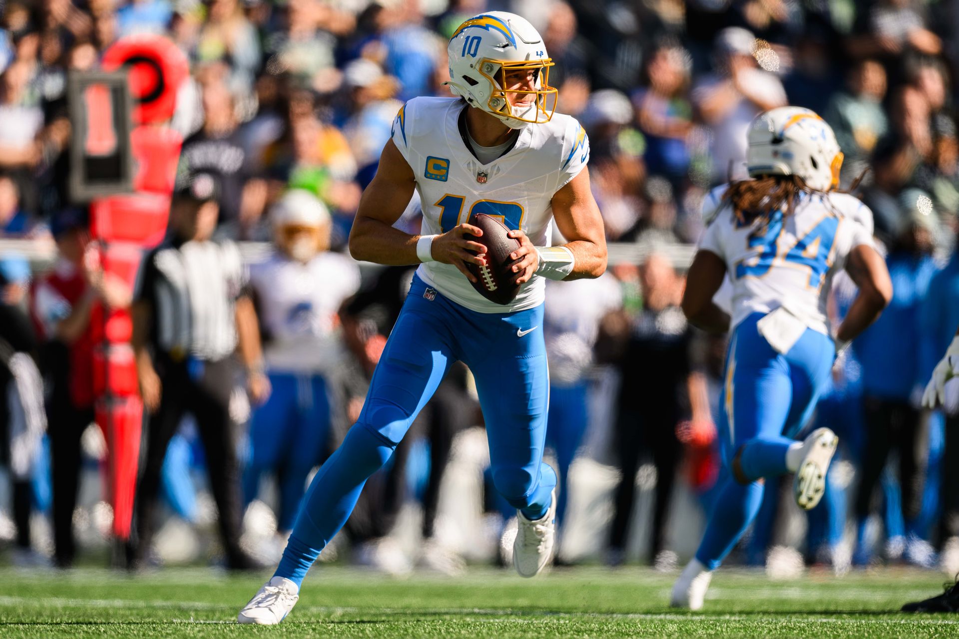 Justin Herbert looks to pass during Seahawks-Chargers game