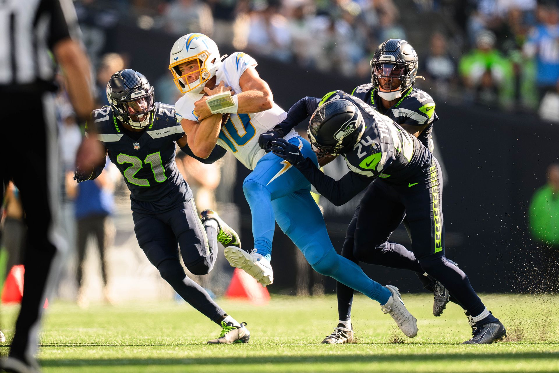 Justin Herbert scrambles with Seahawks defense in pursuit