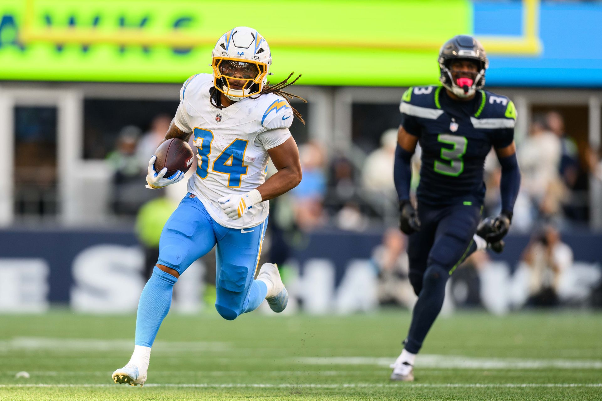 Keaton Mitchell carries the ball for Chargers against Seahawks