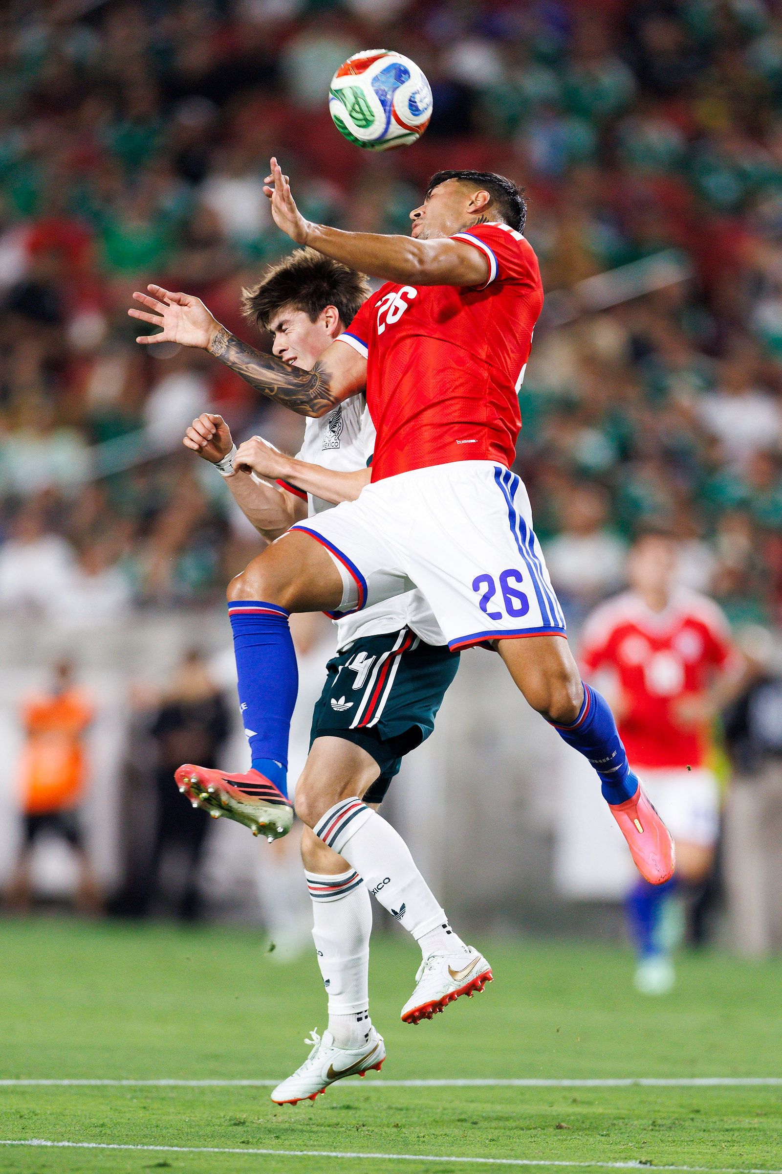 Diego Ulloa heads the ball in the match