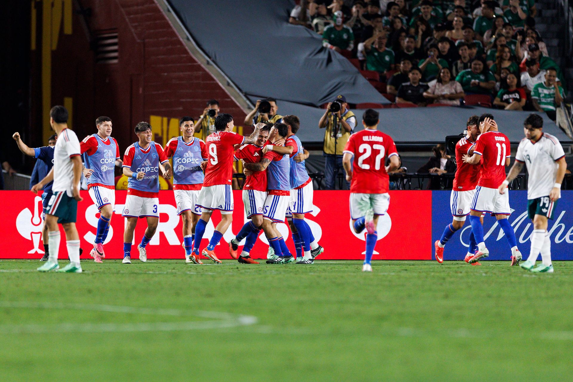 Chile celebrates scoring against Mexico