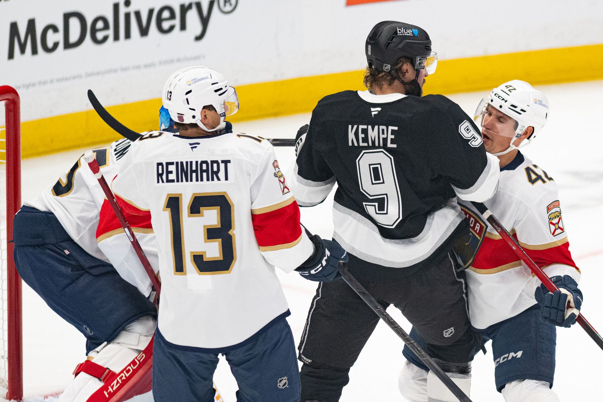 Adrian Kempe fights for position in NHL game against Panthers.