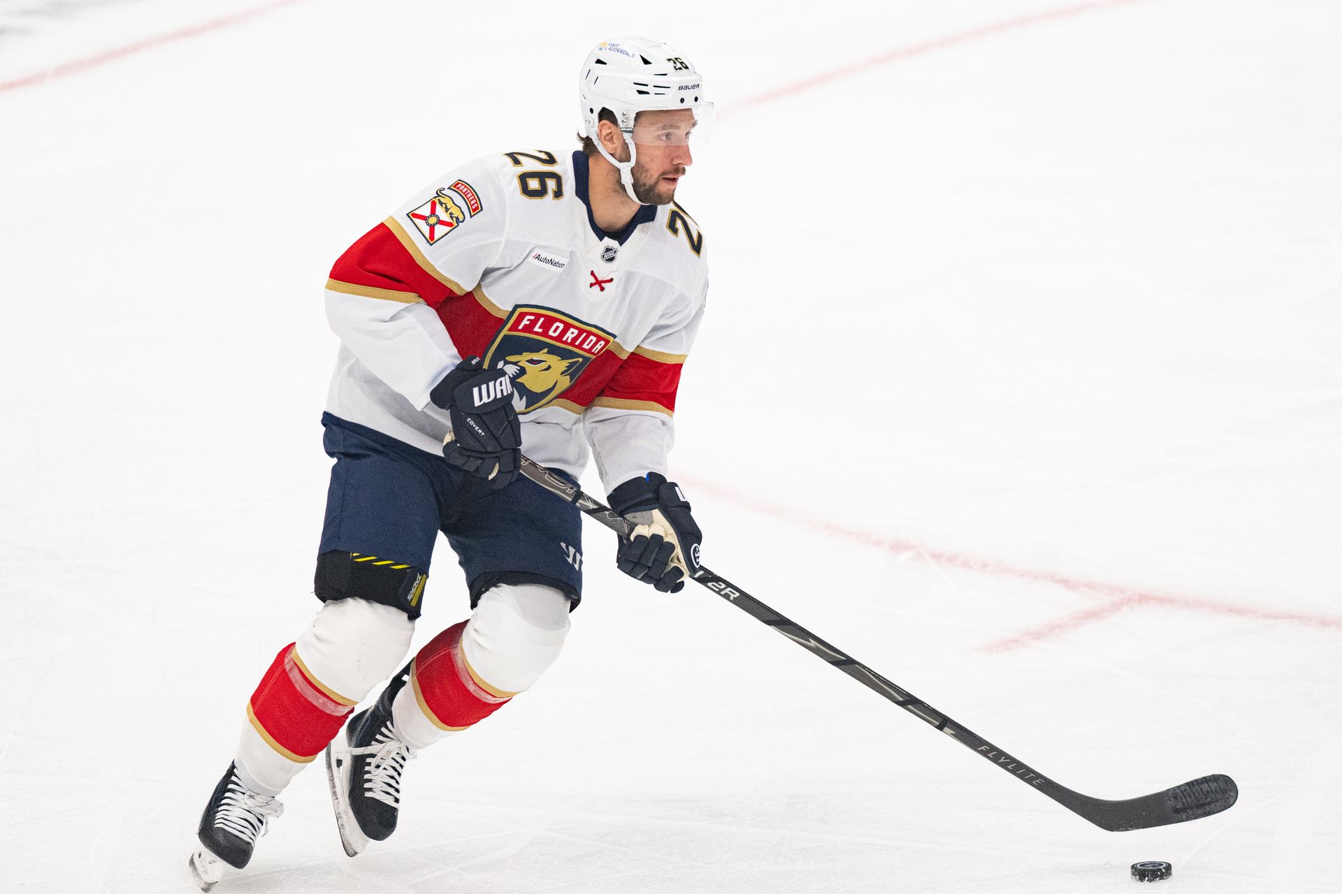 Uvis Balinskis controls the puck in NHL game versus Kings.