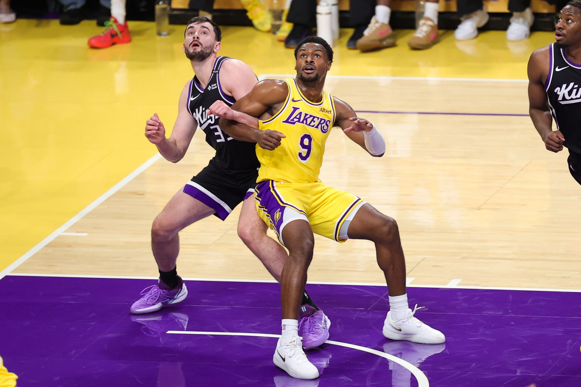Bronny James boxes out for a rebound
