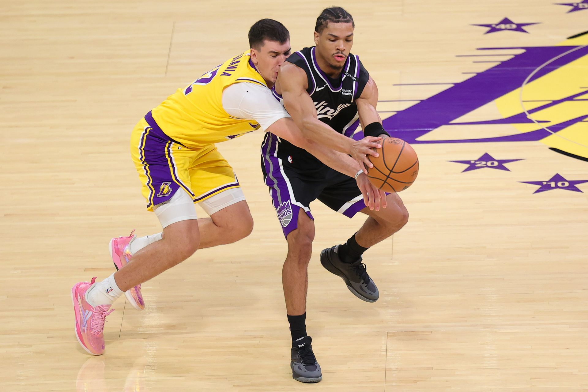Jake LaRavia attempts a steal against the Kings