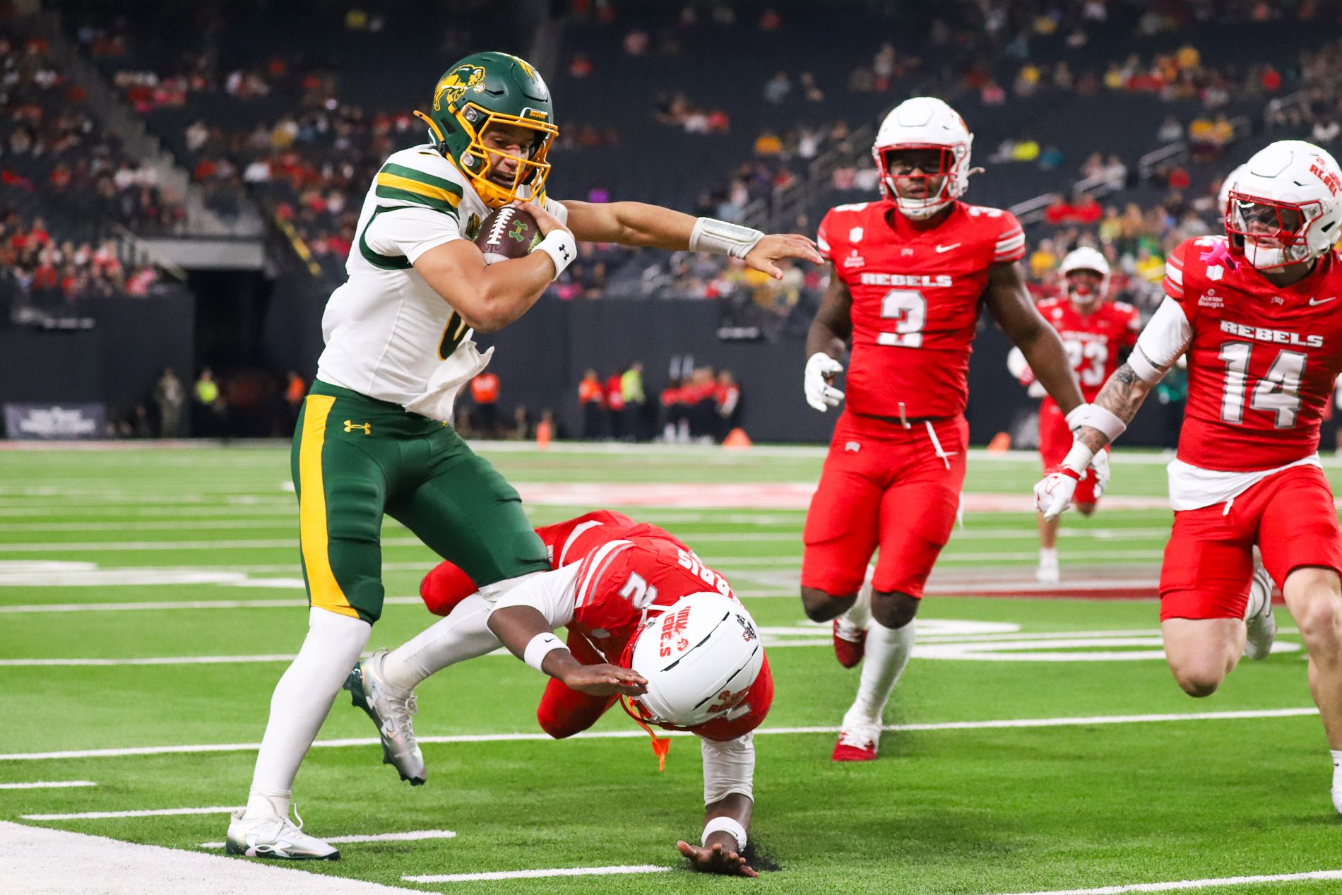 Denver Harris challenges NDSU QB Preston Brown in a tense play.