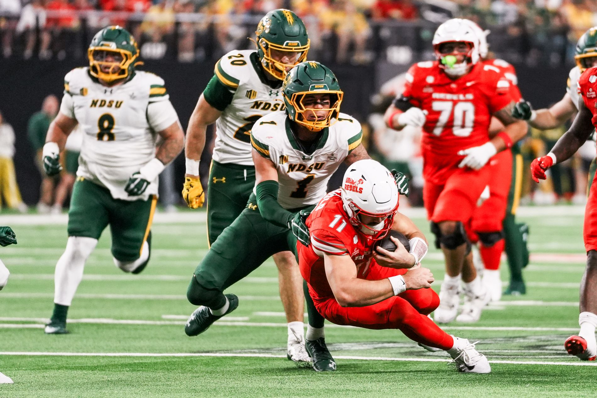 Jackson Arnold tackled by Matthew Stenbroten in a key moment.