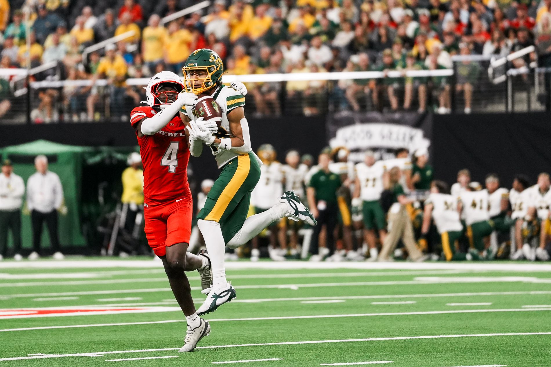 Tony-Louis Nkuba tackles Jackson Williams after a catch.