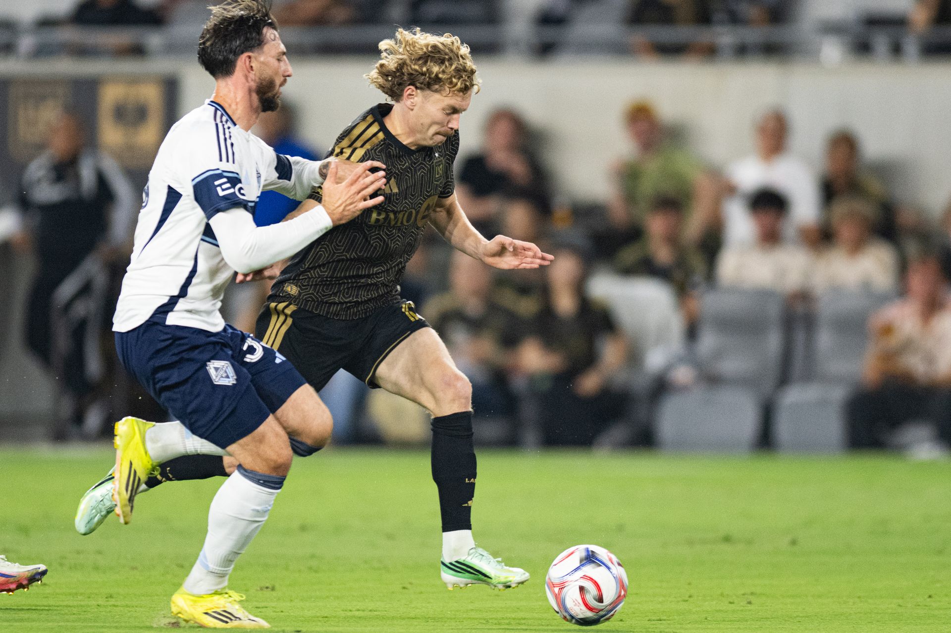 Jacob Shaffelburg (18) drives forward with the ball