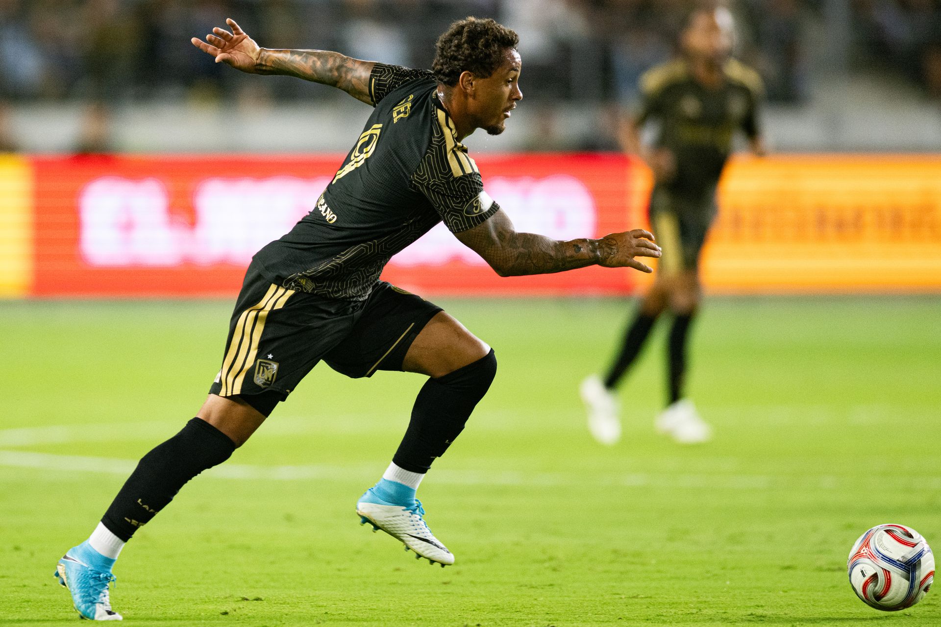 Armindo Sieb (9) pushes forward with the ball