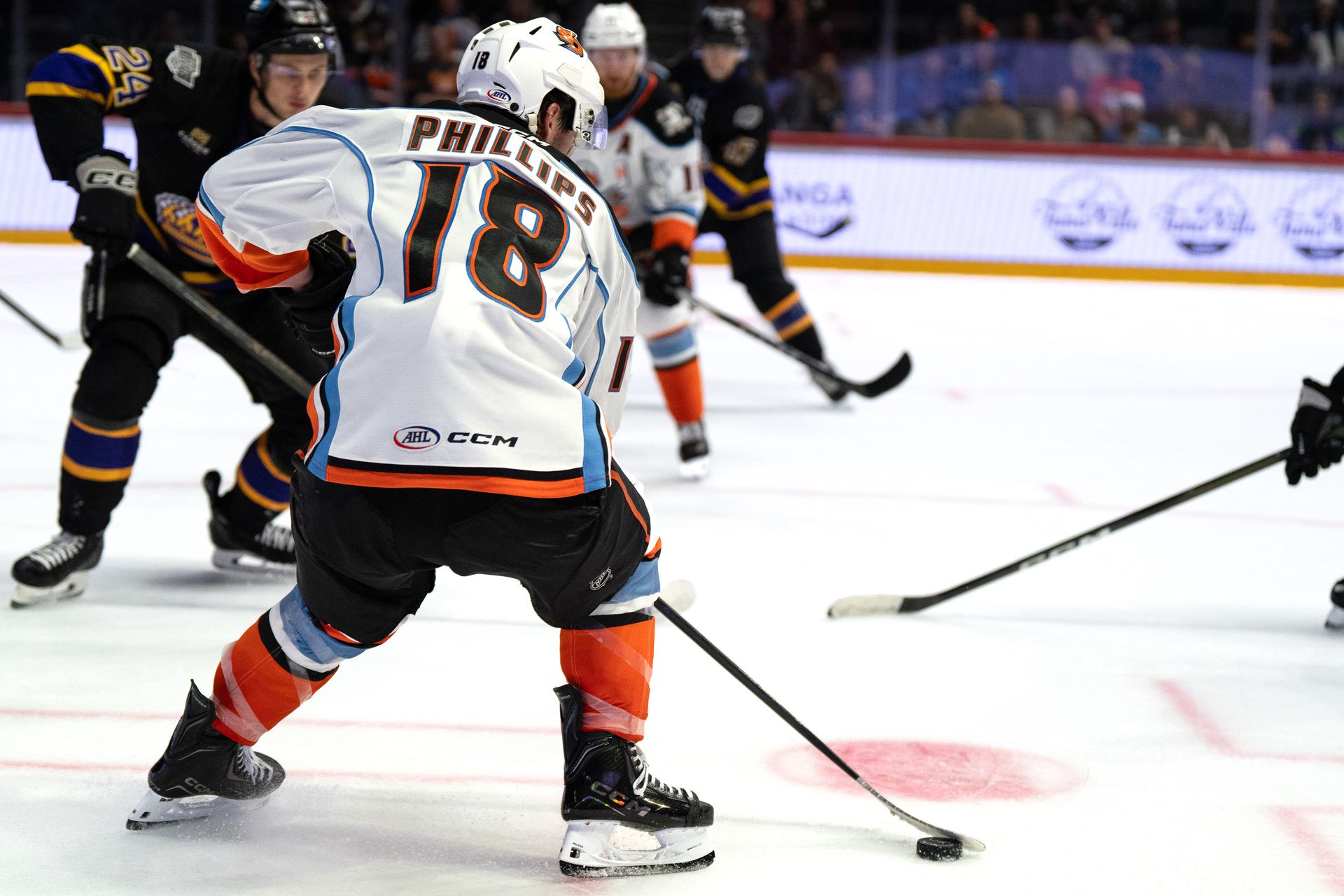Matthew Phillips controls the puck against the Reign