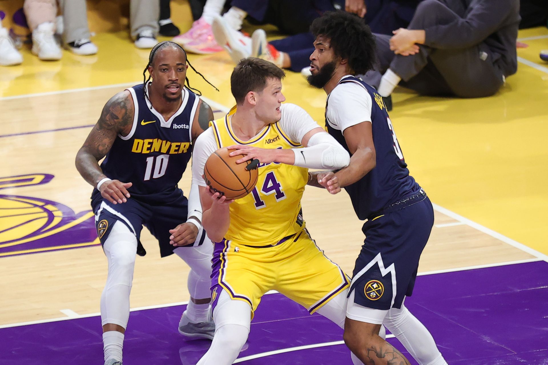 Walker Kessler battles in the post against Denver