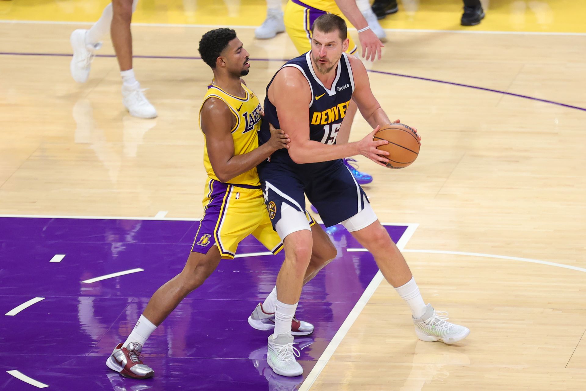 Quentin Grimes guards Nikola Jokic