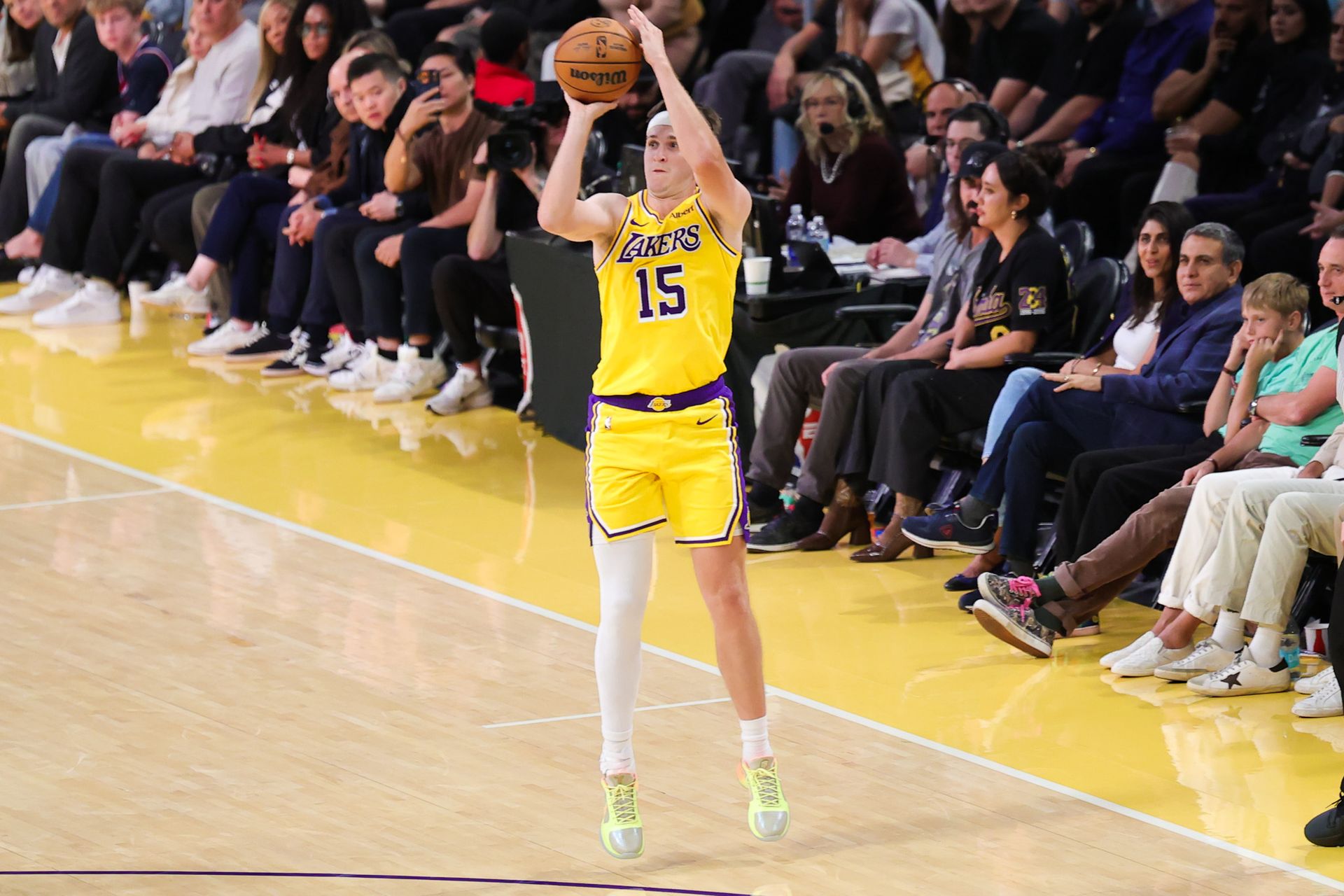 Austin Reaves shoots against the Nuggets