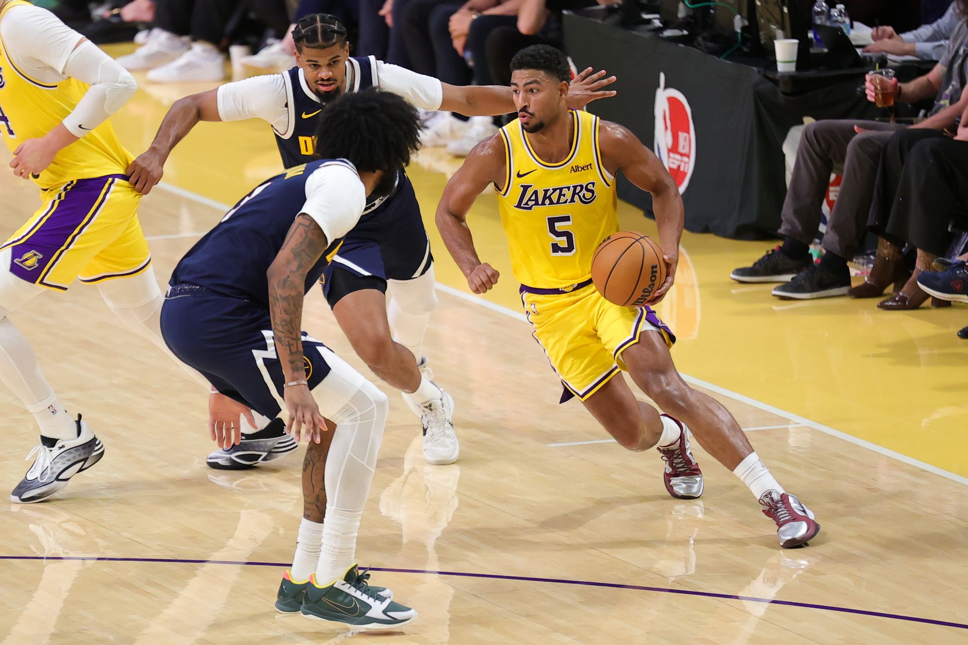 Quentin Grimes handles the ball against Denver