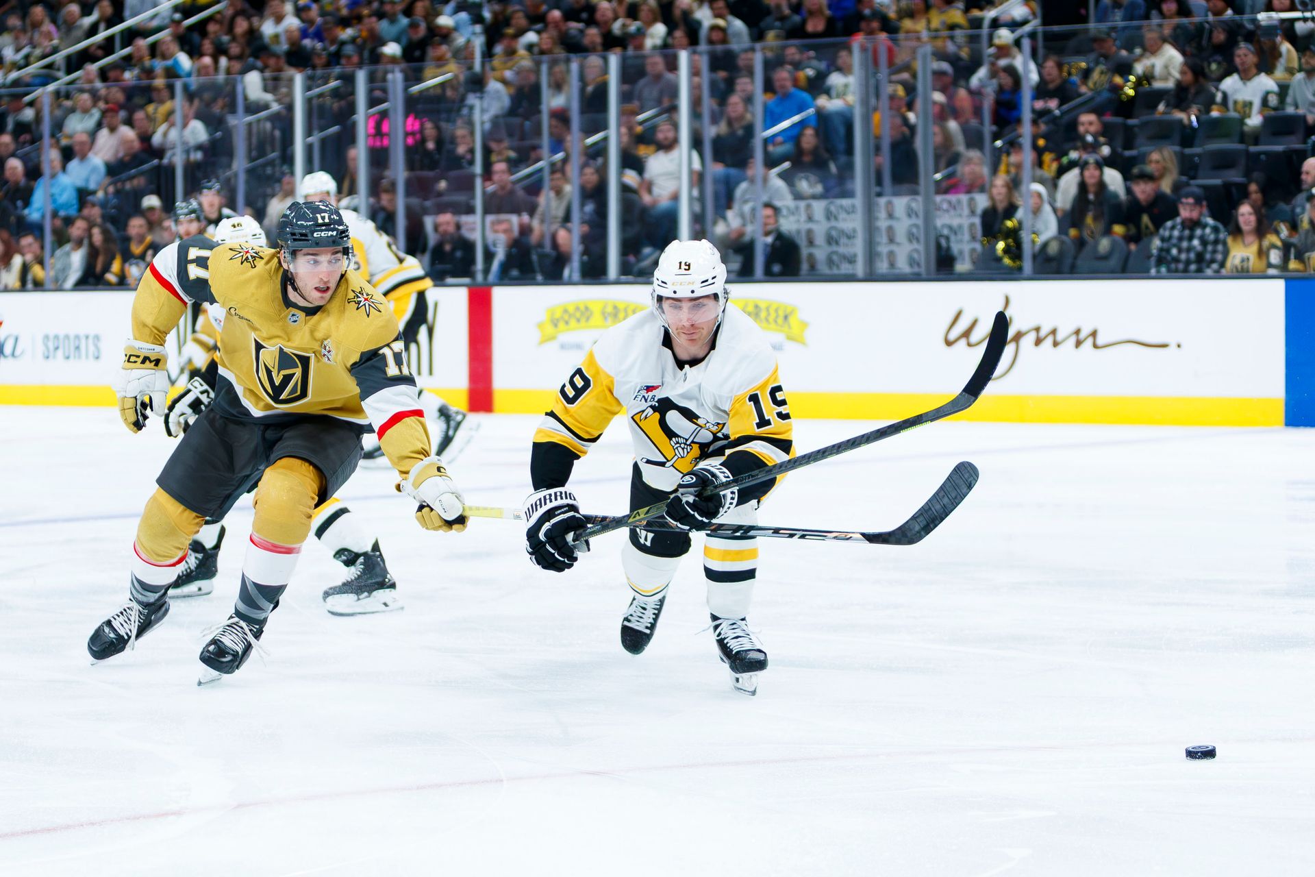 Marc Gatcomb and Connor Dewar battle for possession