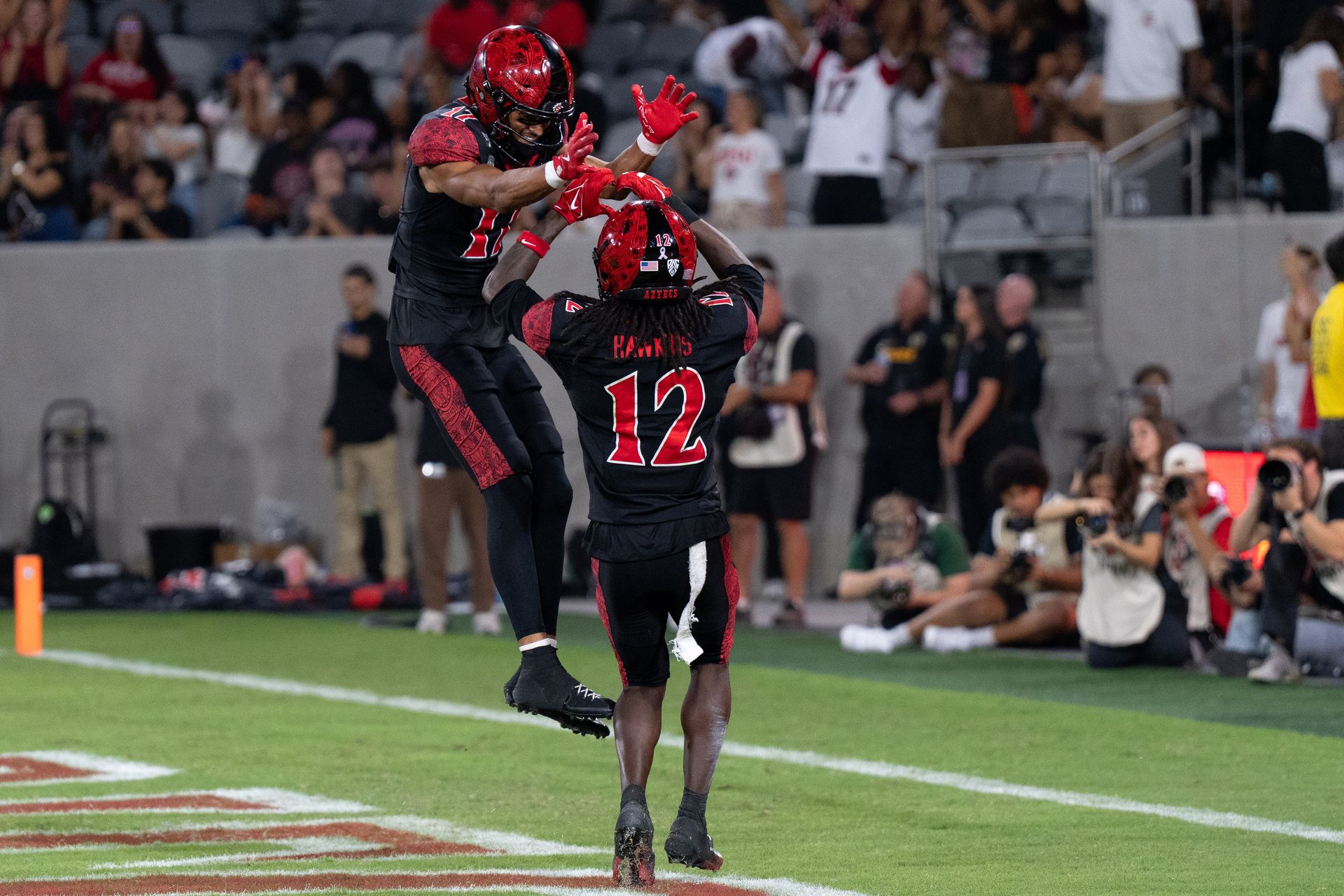 Jaylon Hawkins and Jacob Bostick celebrate a touchdown
